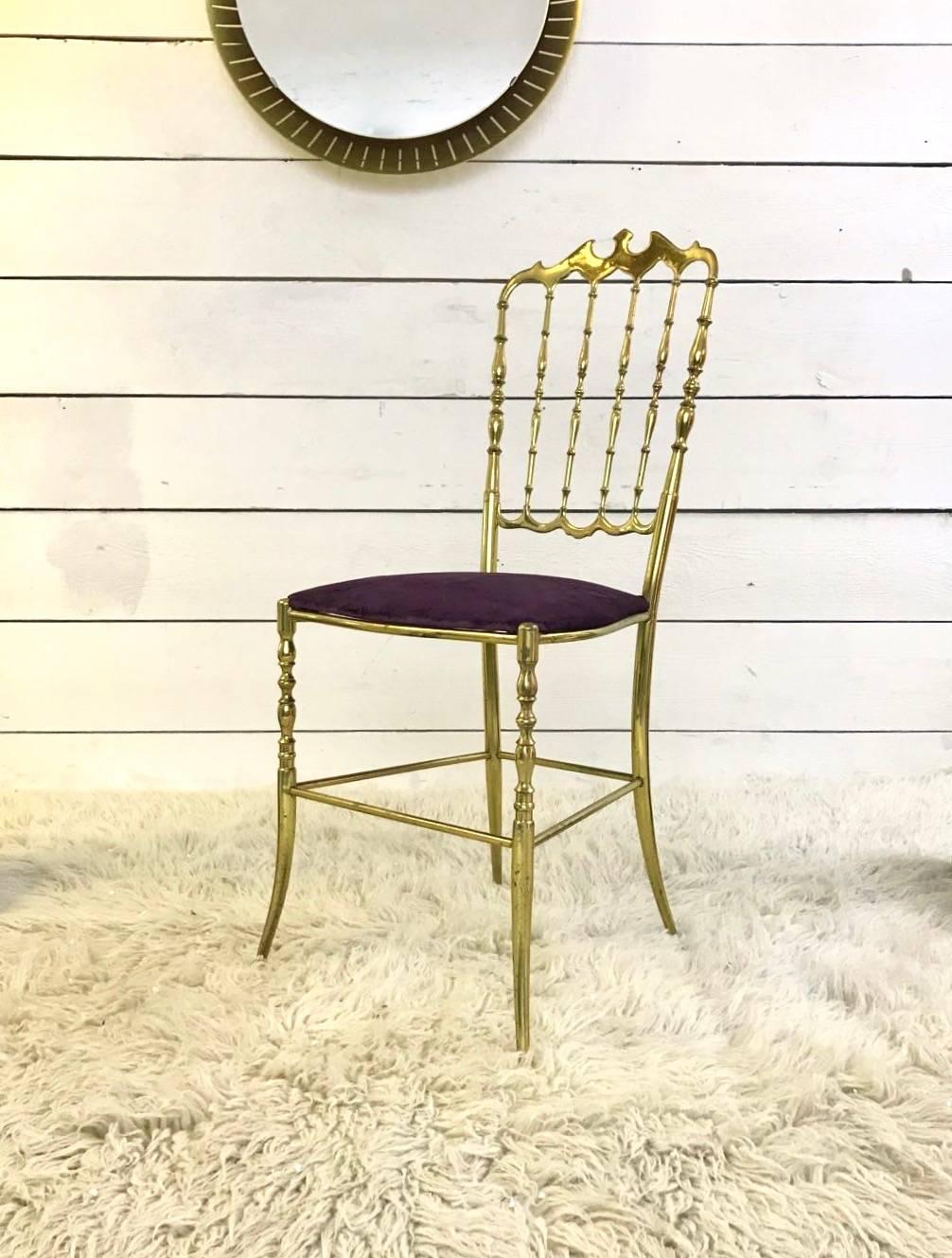 Vintage gilt brass set of Chiavari chairs with purple velvet upholstery, circa 1950.
Originally designed by Giuseppe Gaetano Descalzi and produced since the early 19th century in the town of Chiavari, Italy.
 