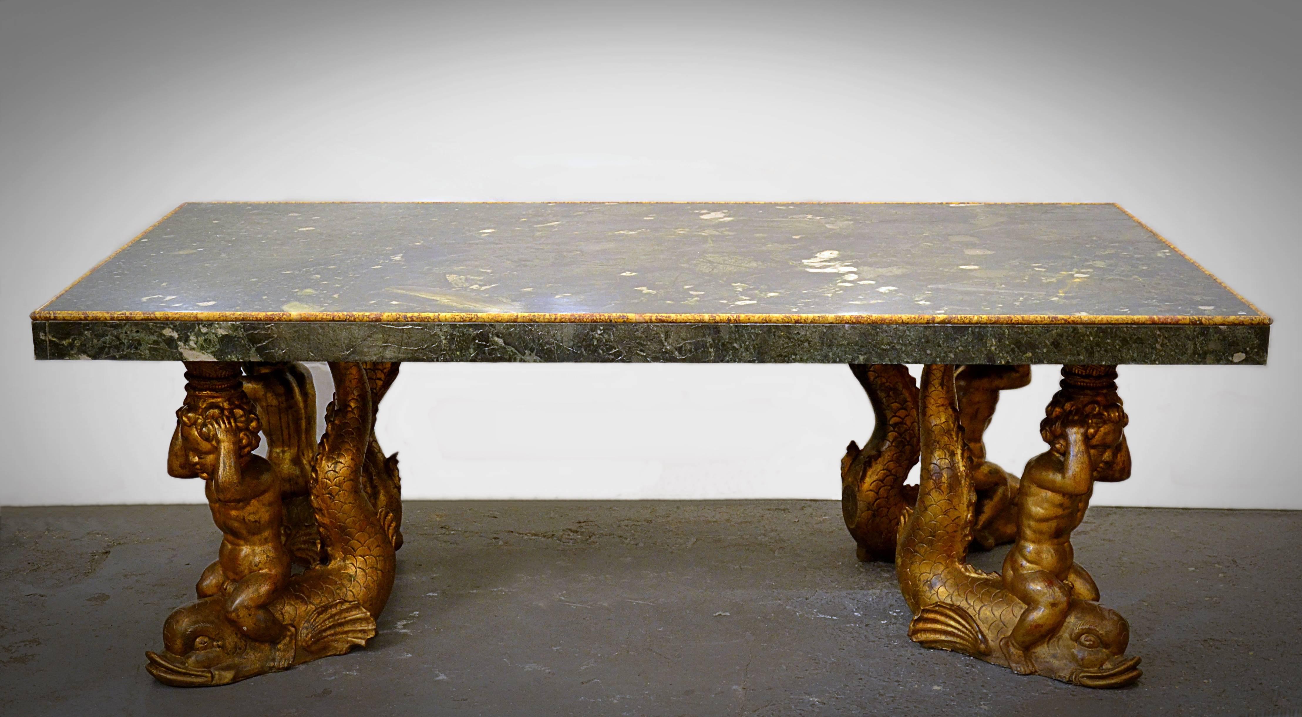 Grand Italian marble and carved gilt stucco dining table.