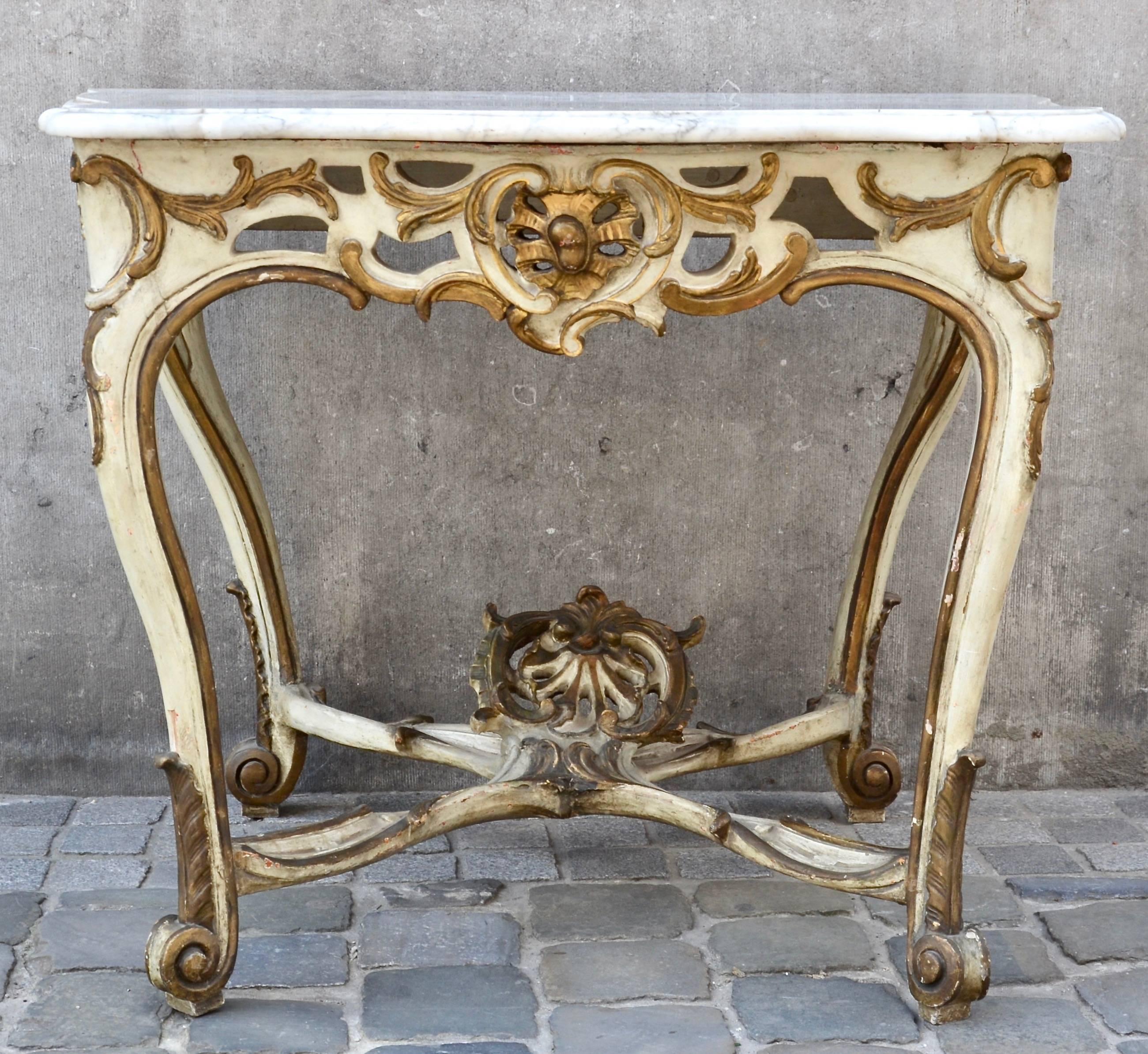 Elegant 18th century Italian Rococo console in marble and carved, gilt and painted wood.