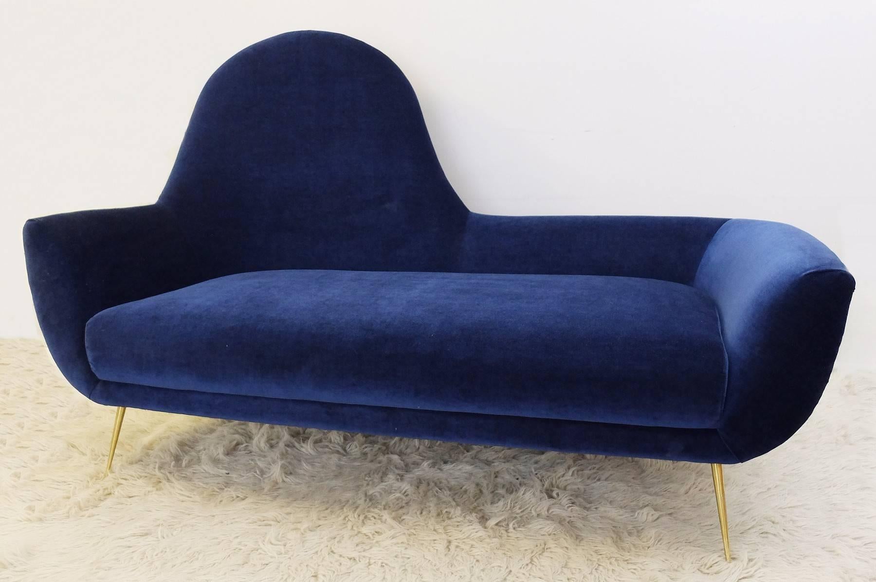 Italian Mid-Century sofa with it's iconic brass legs and new velvet upholstery.