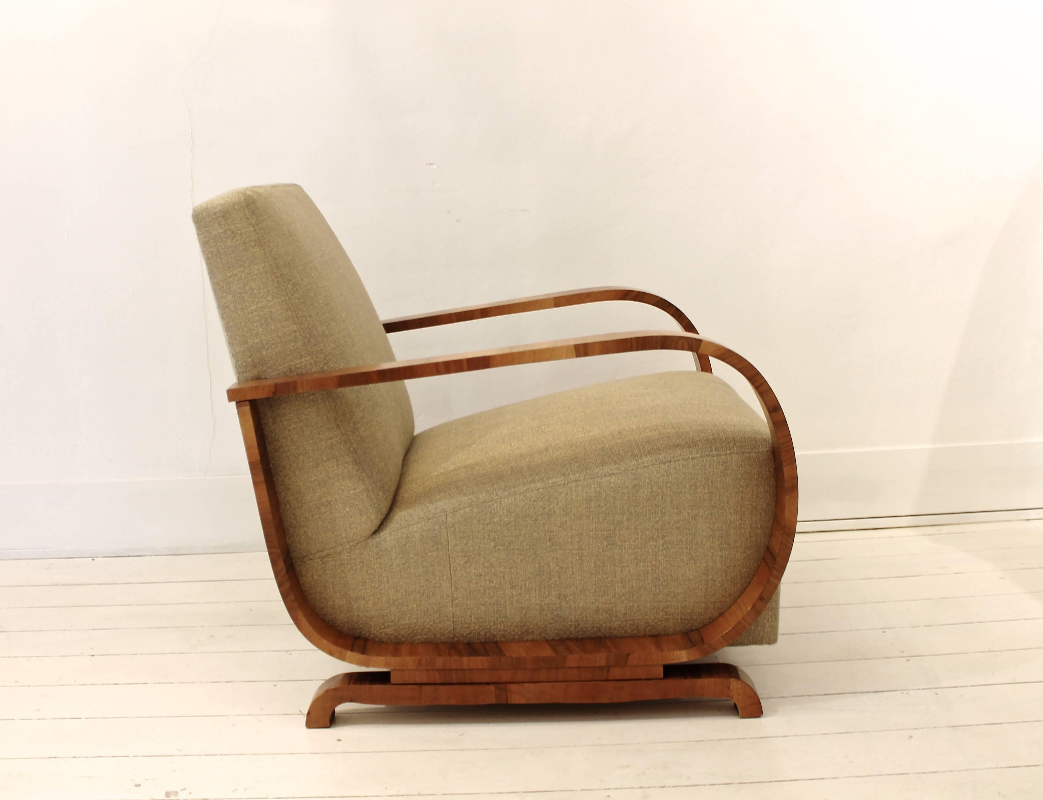 Pair of 1930s Art Deco club armchairs in walnut and newly upholstered using Pierre Frey fabric.