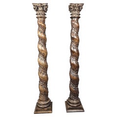 Pair of carved oak twisted columns, Corinthian capitals, early 18th century