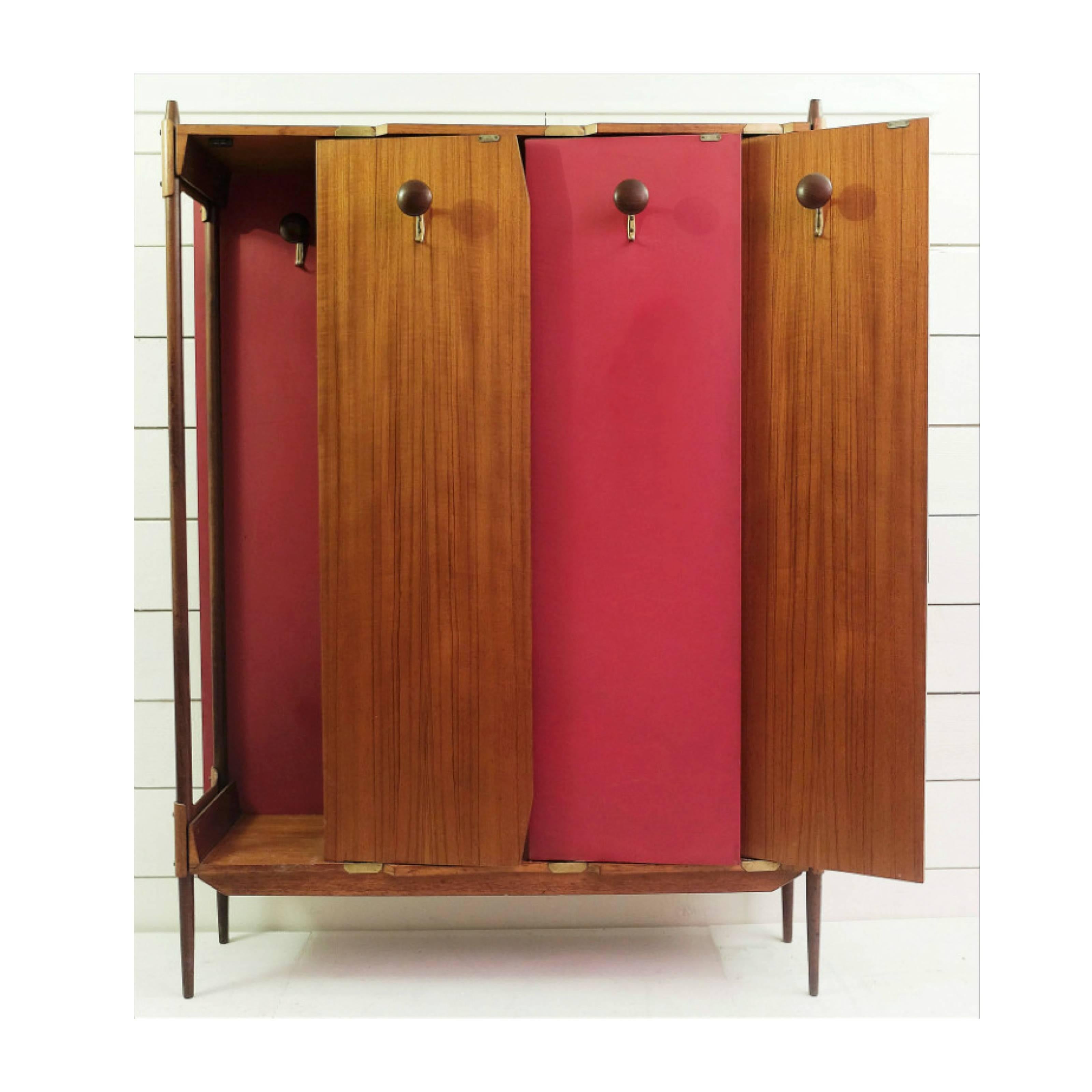 Entry way coat cupboard attributed to Castiglioni, Italy, circa 1950.

In plywood and moleskine.