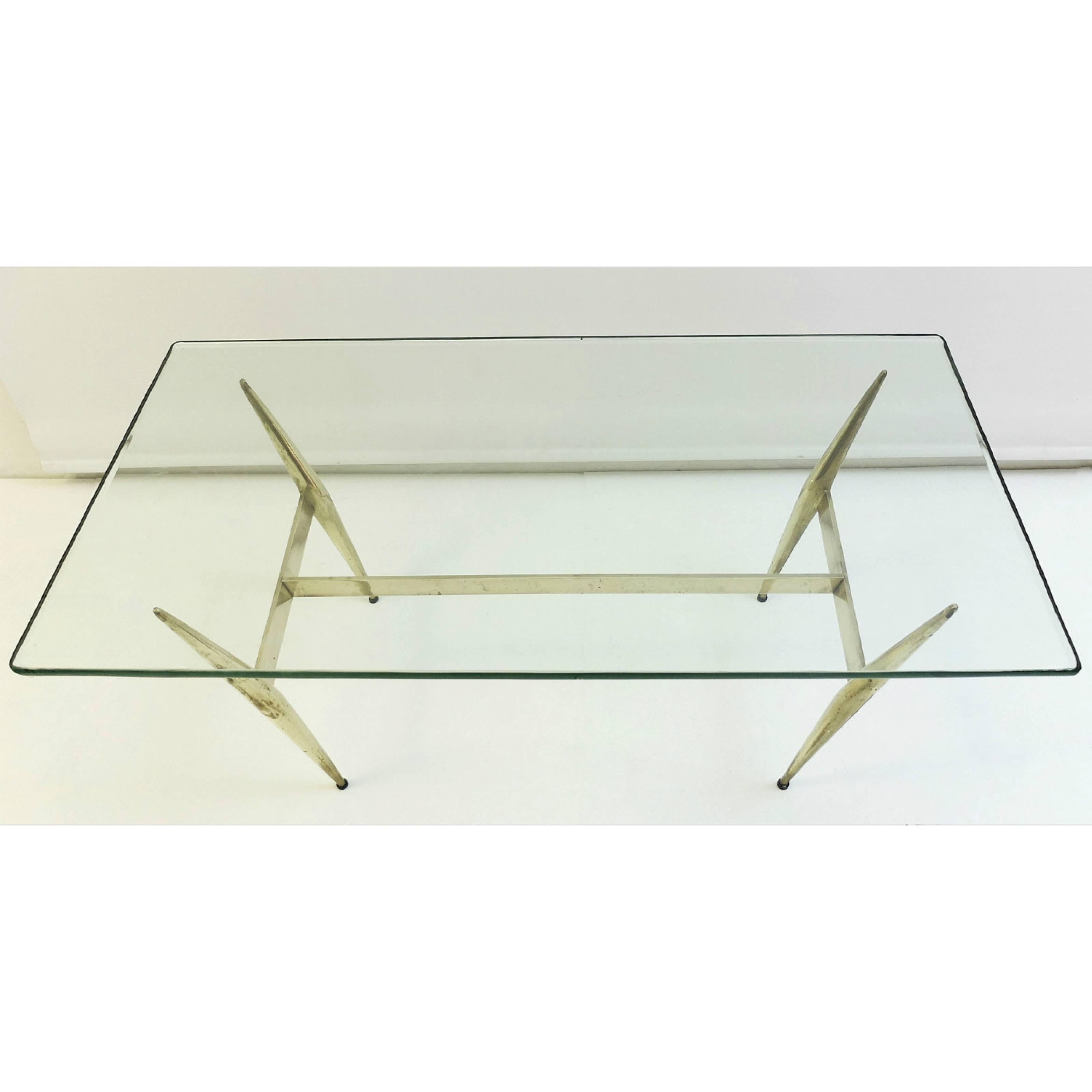 Elegant crystal art coffee table in brass and glass.