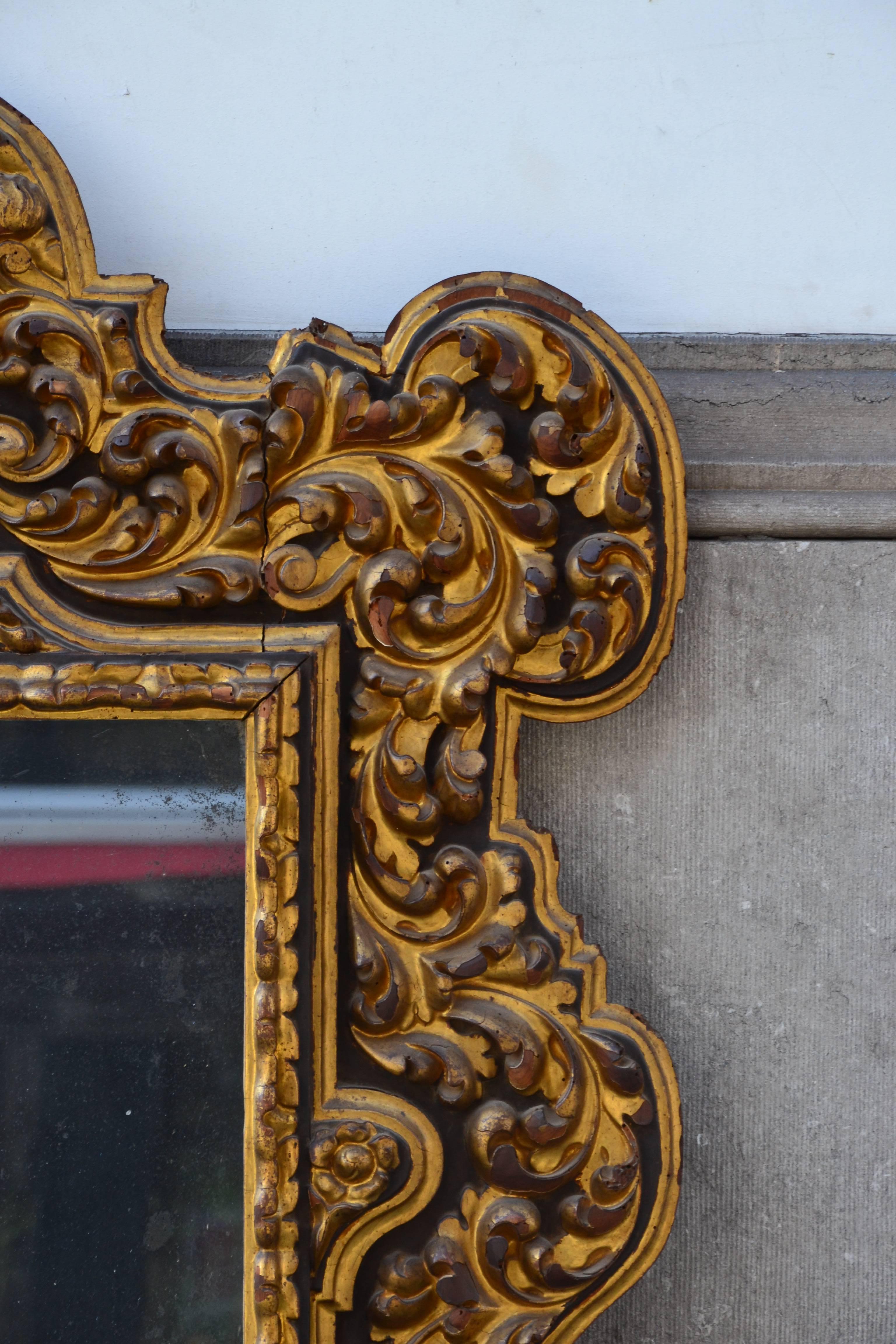 18th Century and Earlier 18th Century Mirror in Carved Giltwood
