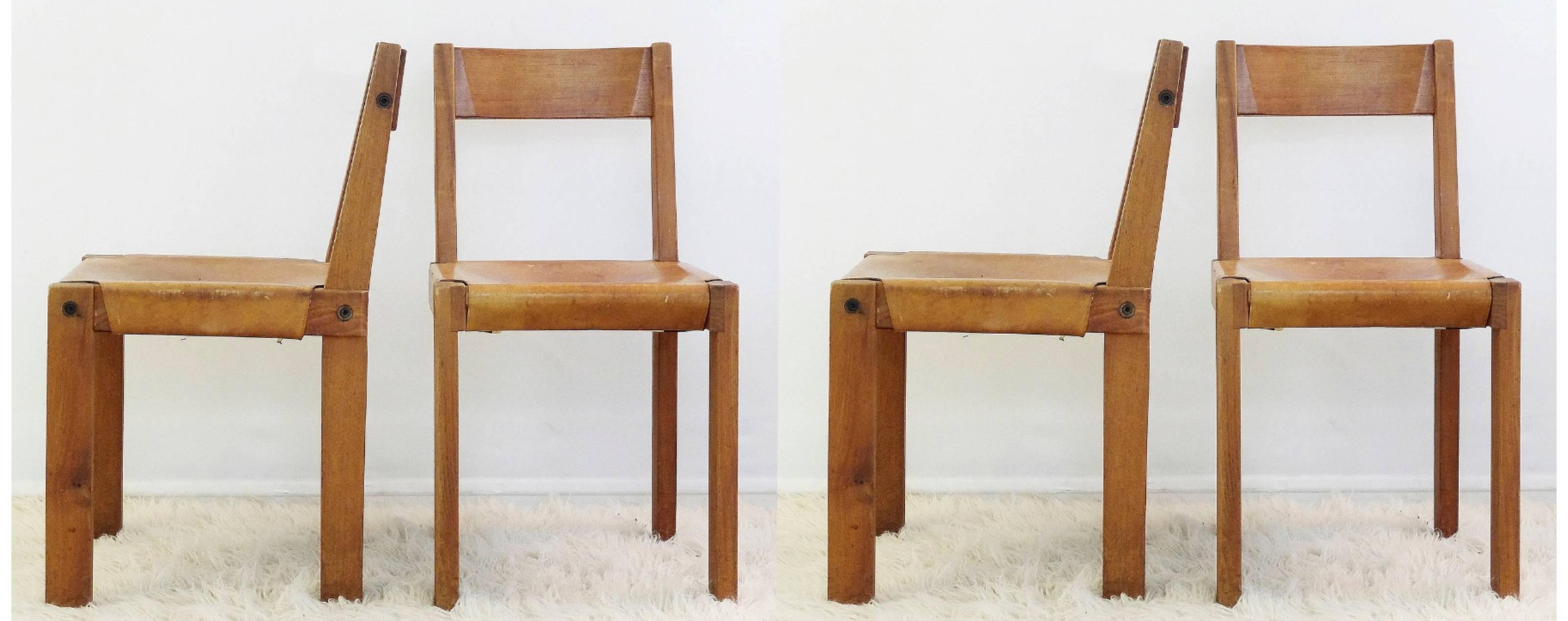 Set of four cognac leather and solid elm dining chairs by Pierre Chapo, France,
circa 1970.
Model 