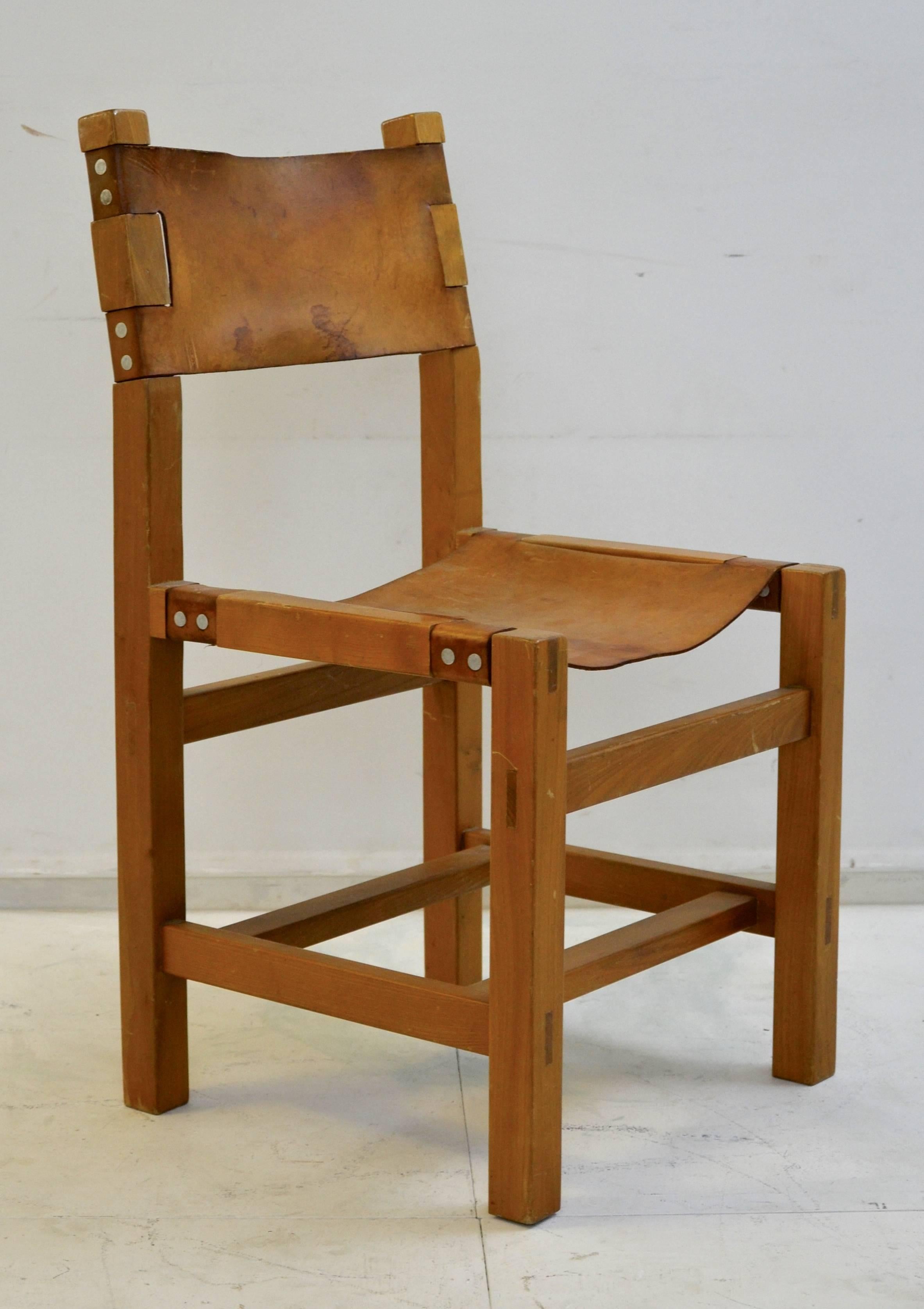 Set of ten solid elm and cognac leather chairs designed by Maison Regain, France.