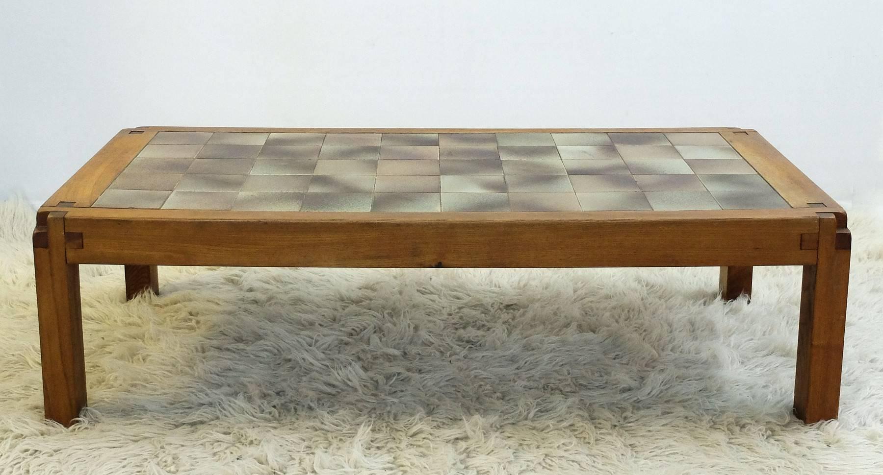Coffee table in ceramic and elm by French designer Pierre Chapo, circa 1965.

Pierre Chapo (1927-1987) is born in a family of craftsmen. After his regular studies, he worked for some time in the workshop of a navy carpenter. He was graduated