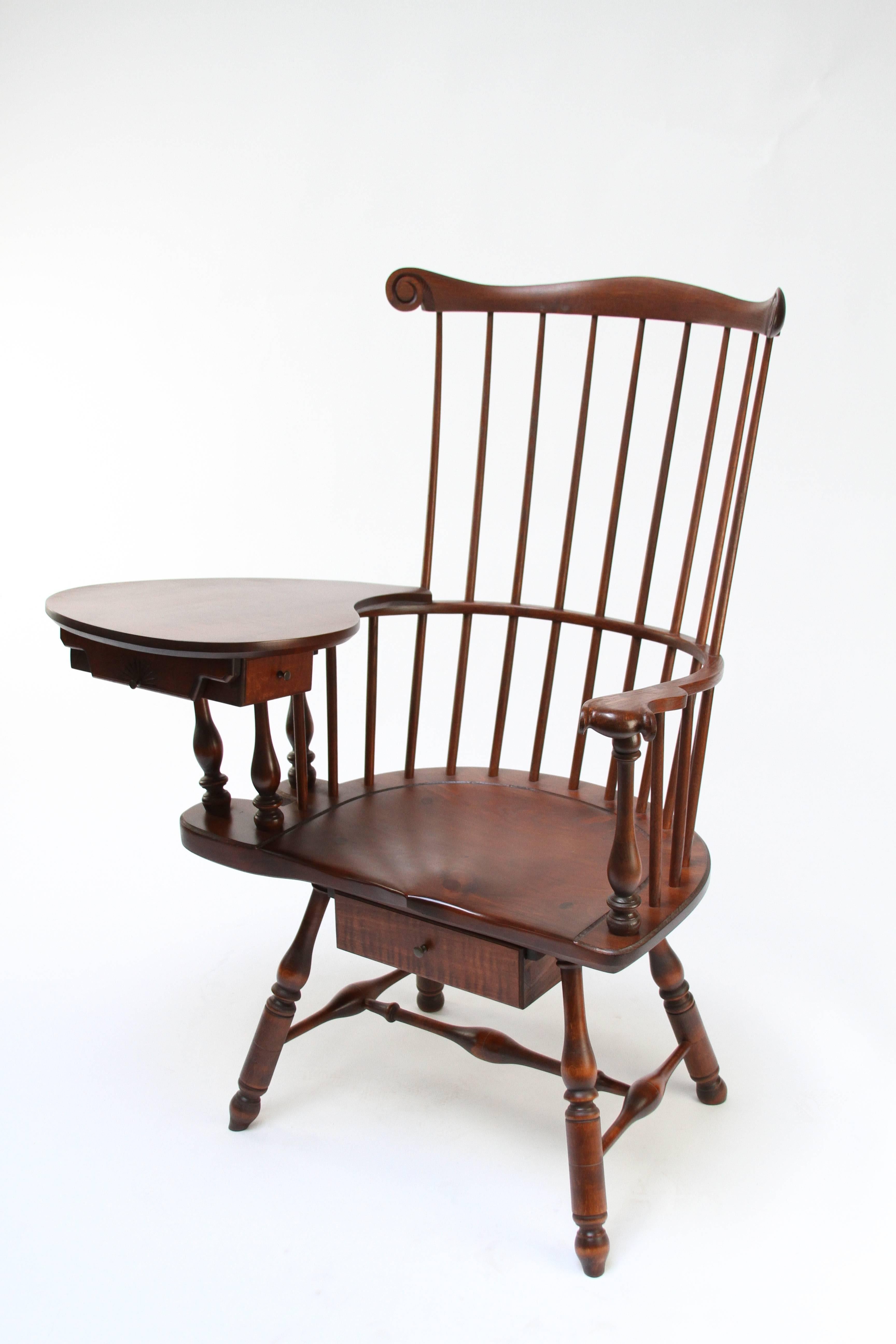 A modern heirloom that can be enjoyed for generations. The design can be ordered with a right-handed or left-handed writing desk. The finish shown is called Early American stain and this piece is built with a pine seat and a hand-carved Knuckle on