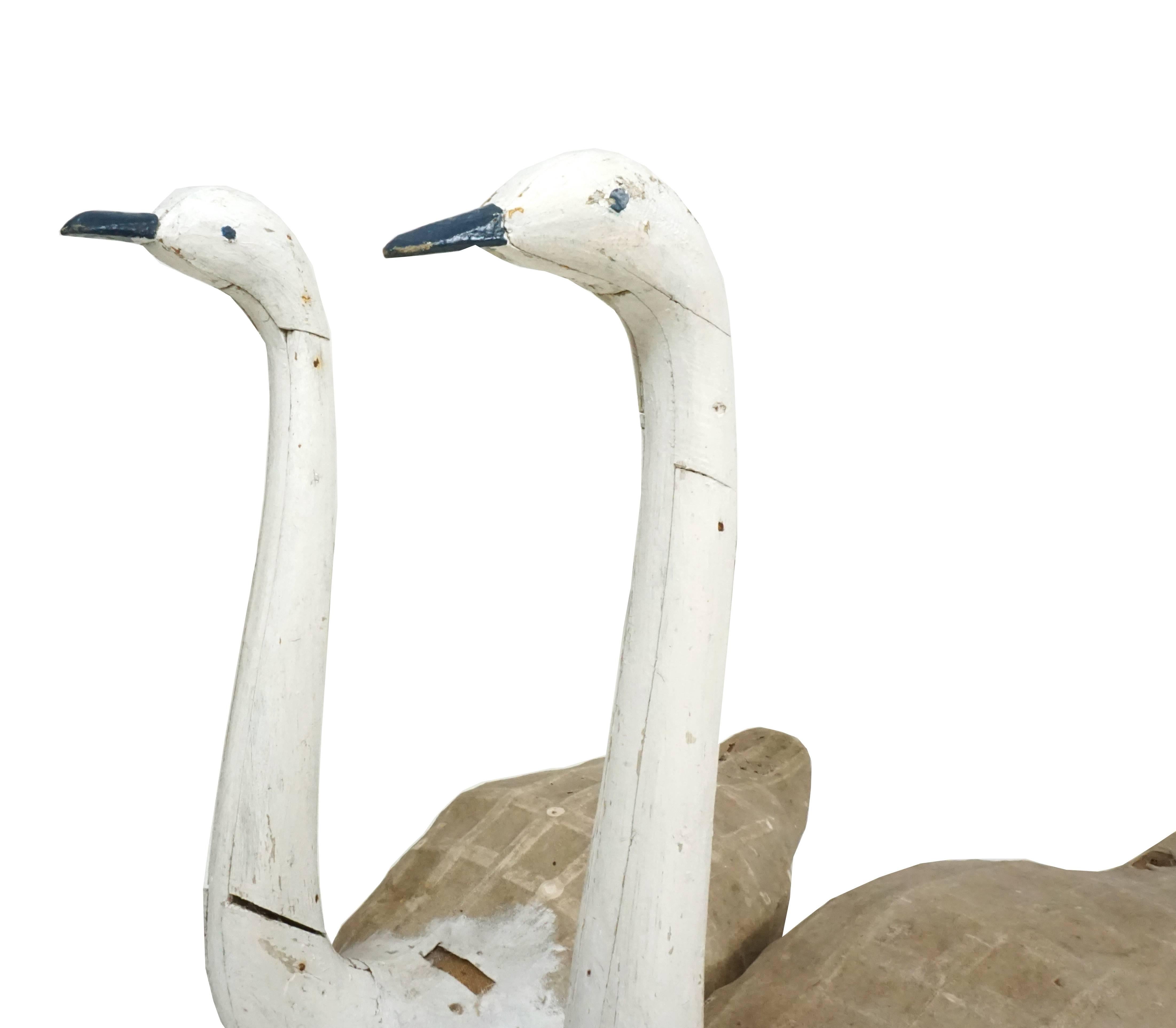 A very rare pair of swan decoys made by one of Denmark best decoy makers Niels Poulsker, circa 1900, Northwest Jutland, Denmark. The pair was used and shows signs of use and hits.