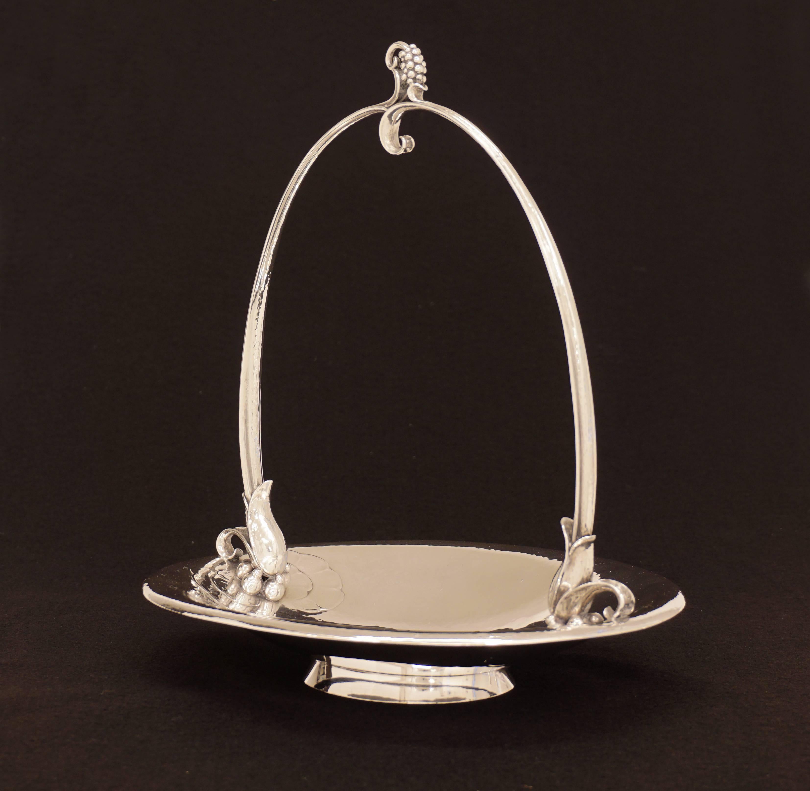 Harald Nielsen for Georg Jensen, grape stand designed 1929. Sterling. Design #543. When grapes are clipped they will fall into the basket. Made by Georg Jensen, 2011.