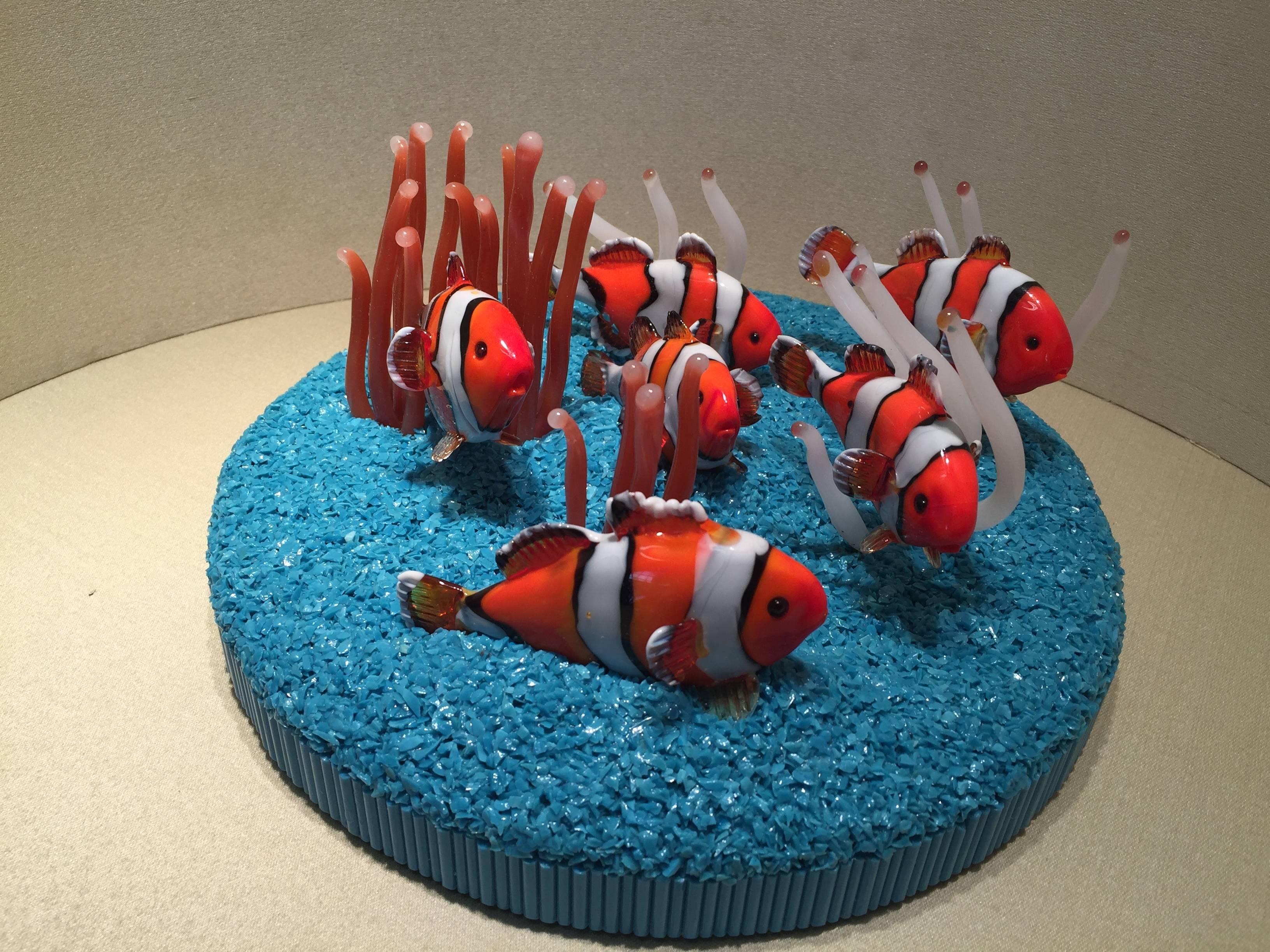 An amazing and one of a kind Murano glass sculpture with different types of fish to represent a small barrier reef, the base in square shape is covered with glass mosaic, high quality details totally handmade.

Check other beautiful Art Works in