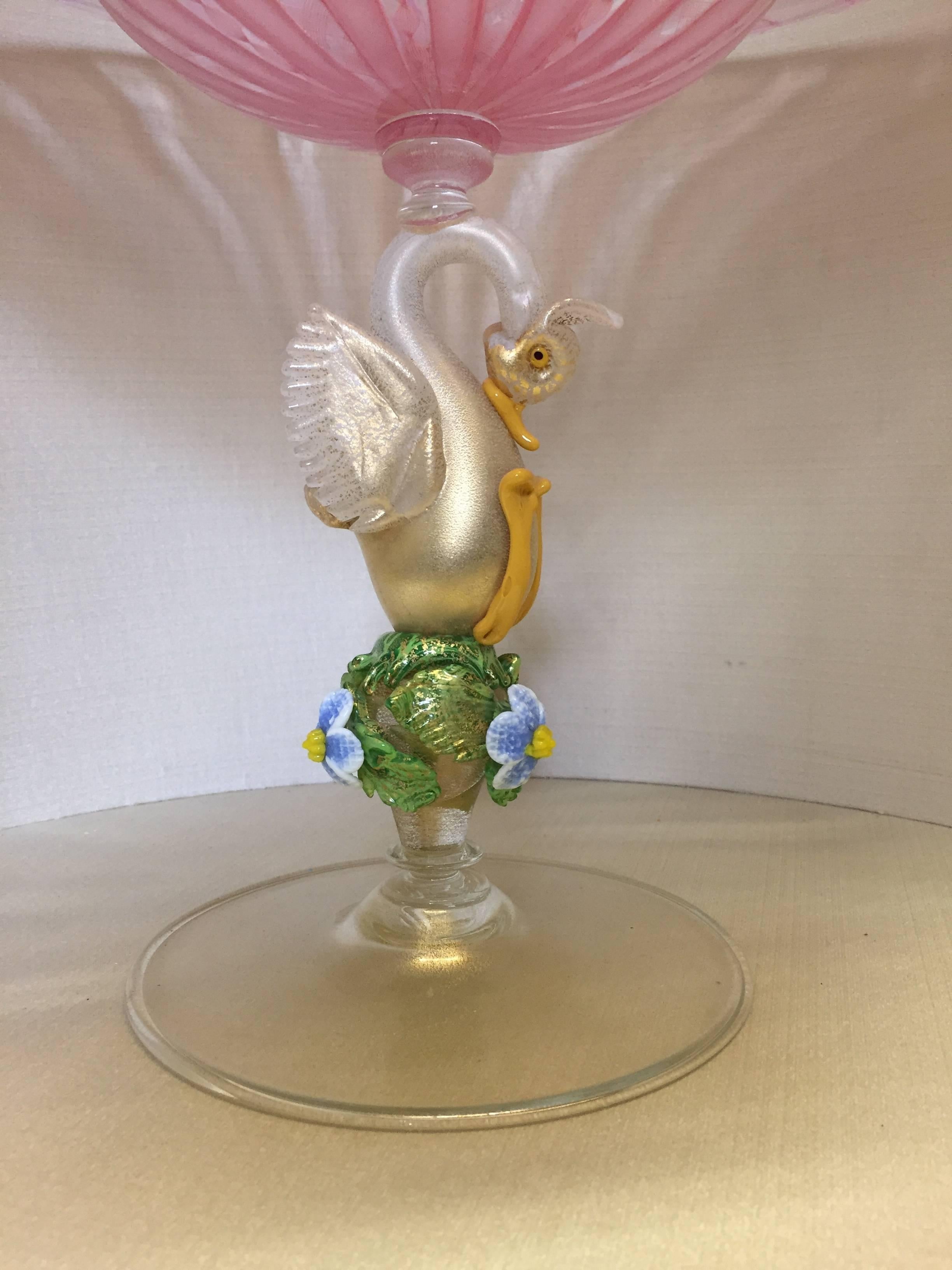 Amazing centerpiece with zanfirico glass bowl sits on an opal glass swan with 24-karat gold leaf, flowers and leaves make precious the stem, made by G. Seguso.