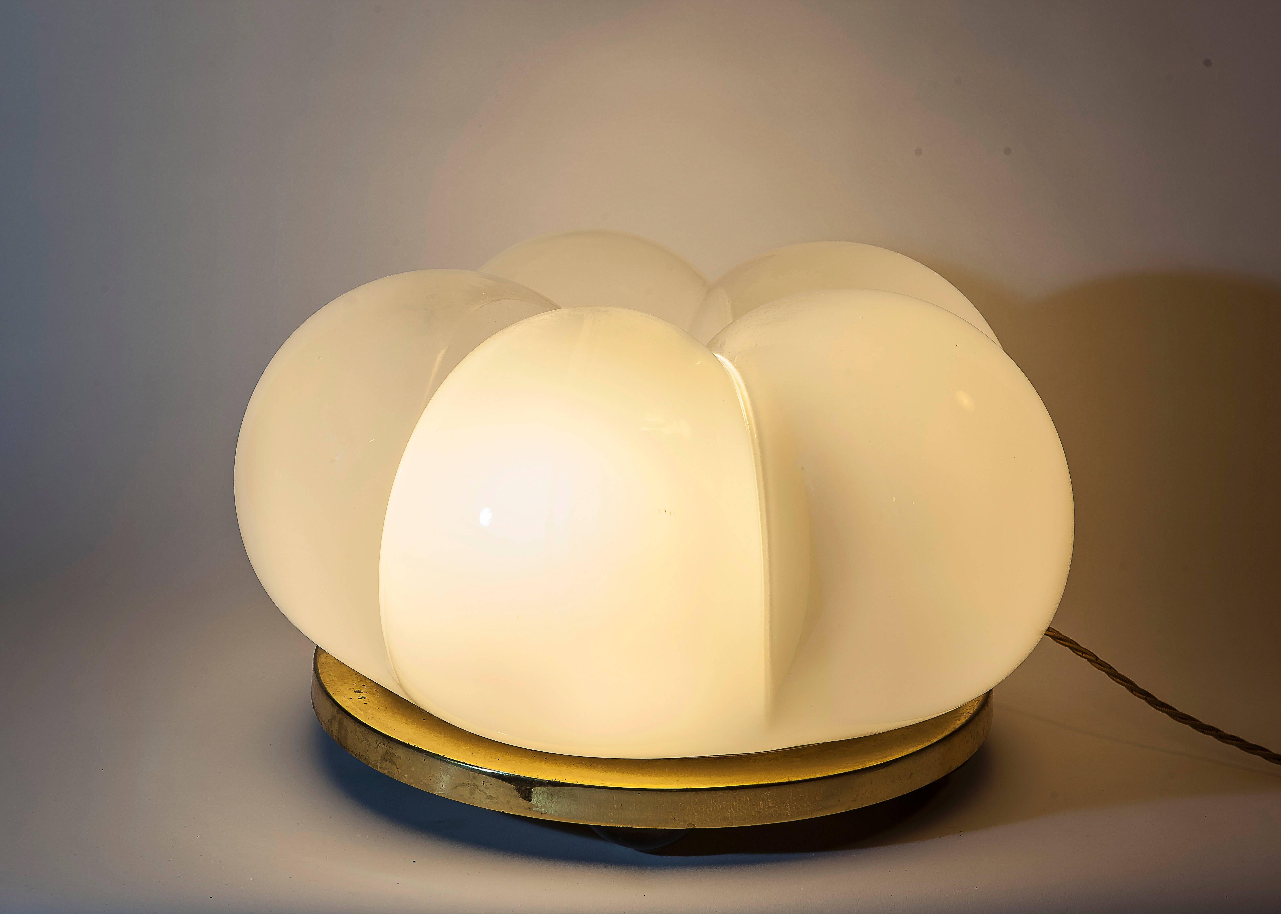 A very nice "lattimo" glass sculpture lamp consisting of a brass base with an abstract sculpture inside a big blown glass shade in the shape of a cloud.