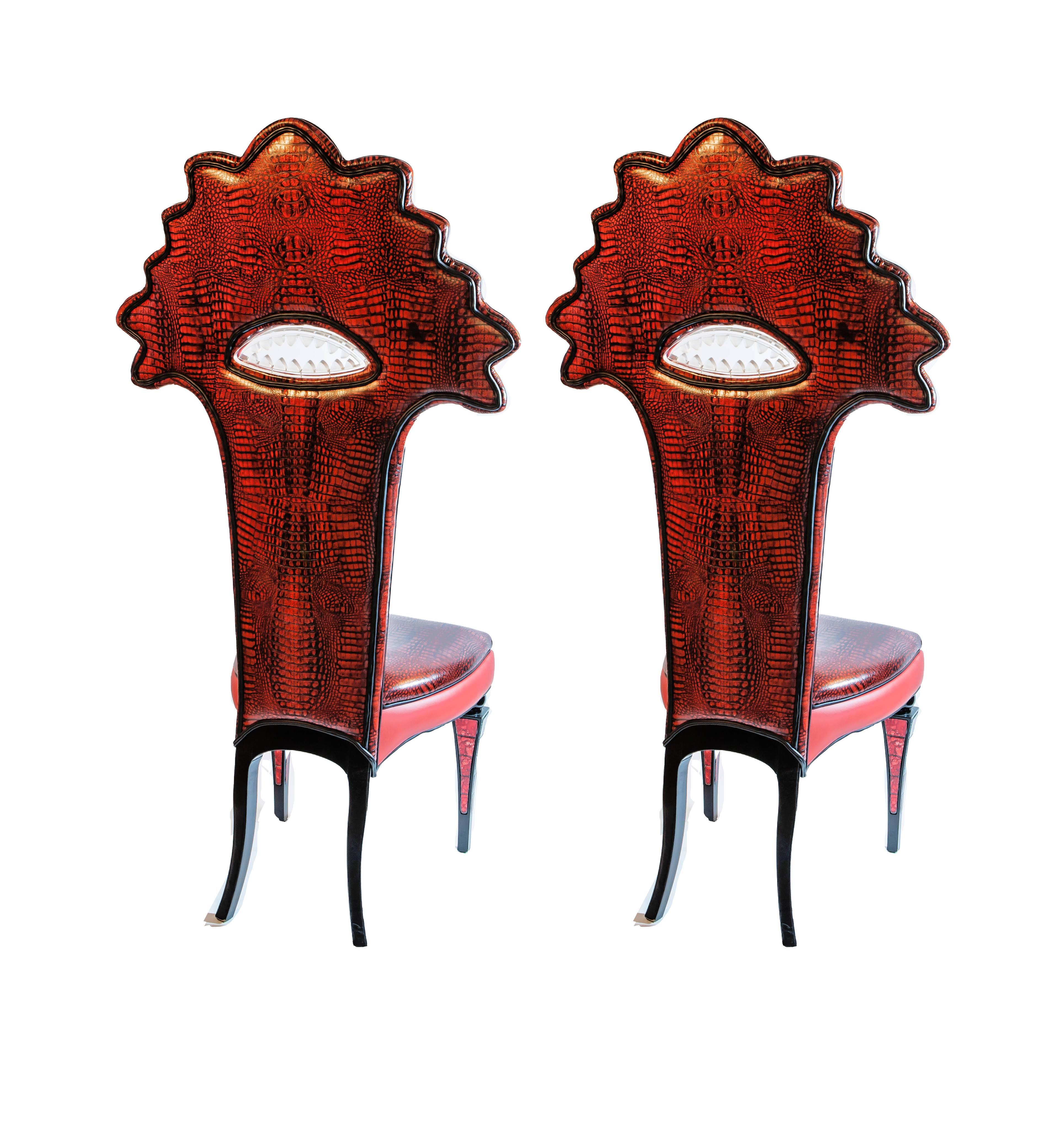 Amazing set of six chairs with a stylized head of a shark on the waves, lucite's mouth, lined with red leather and ebonized legs with glass mosaic.