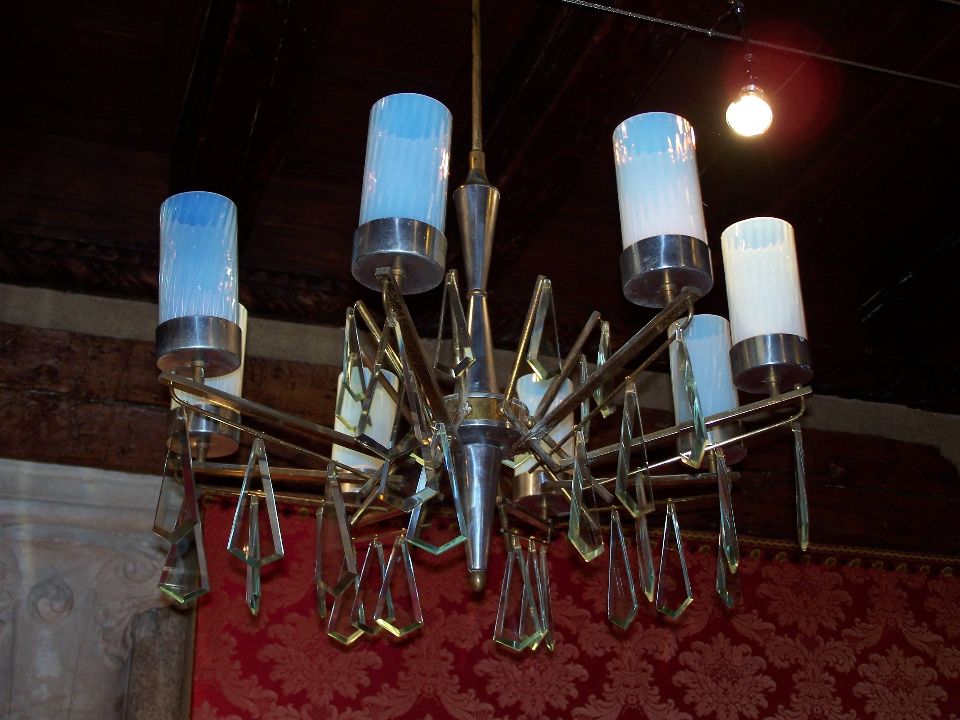 Vintage eight-arm chandelier with opal glass lampshade, chromium-plated aluminium and brass stem with cut glass pendant.