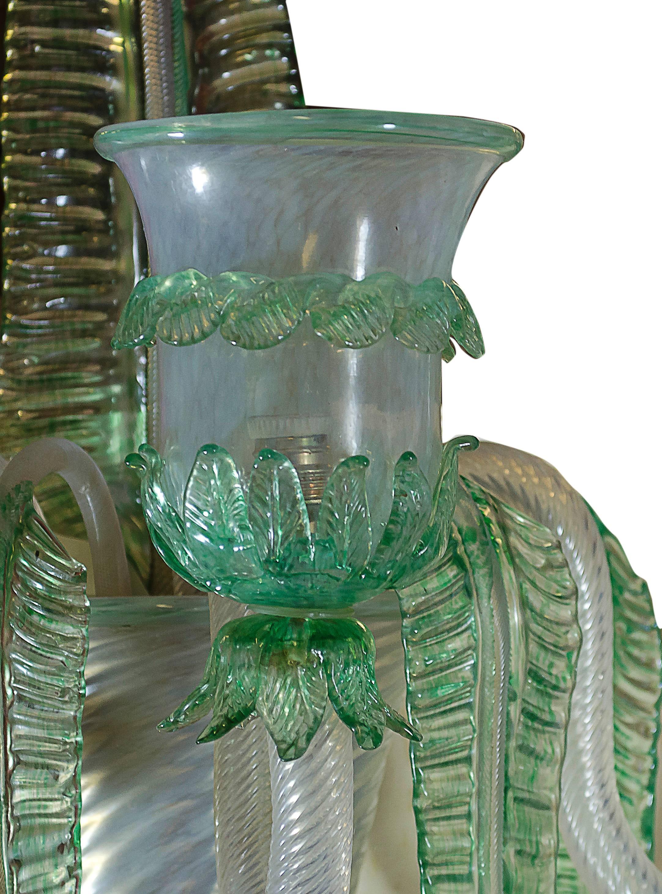 Three arms green and opal glass sconce with big leaf in the middle.