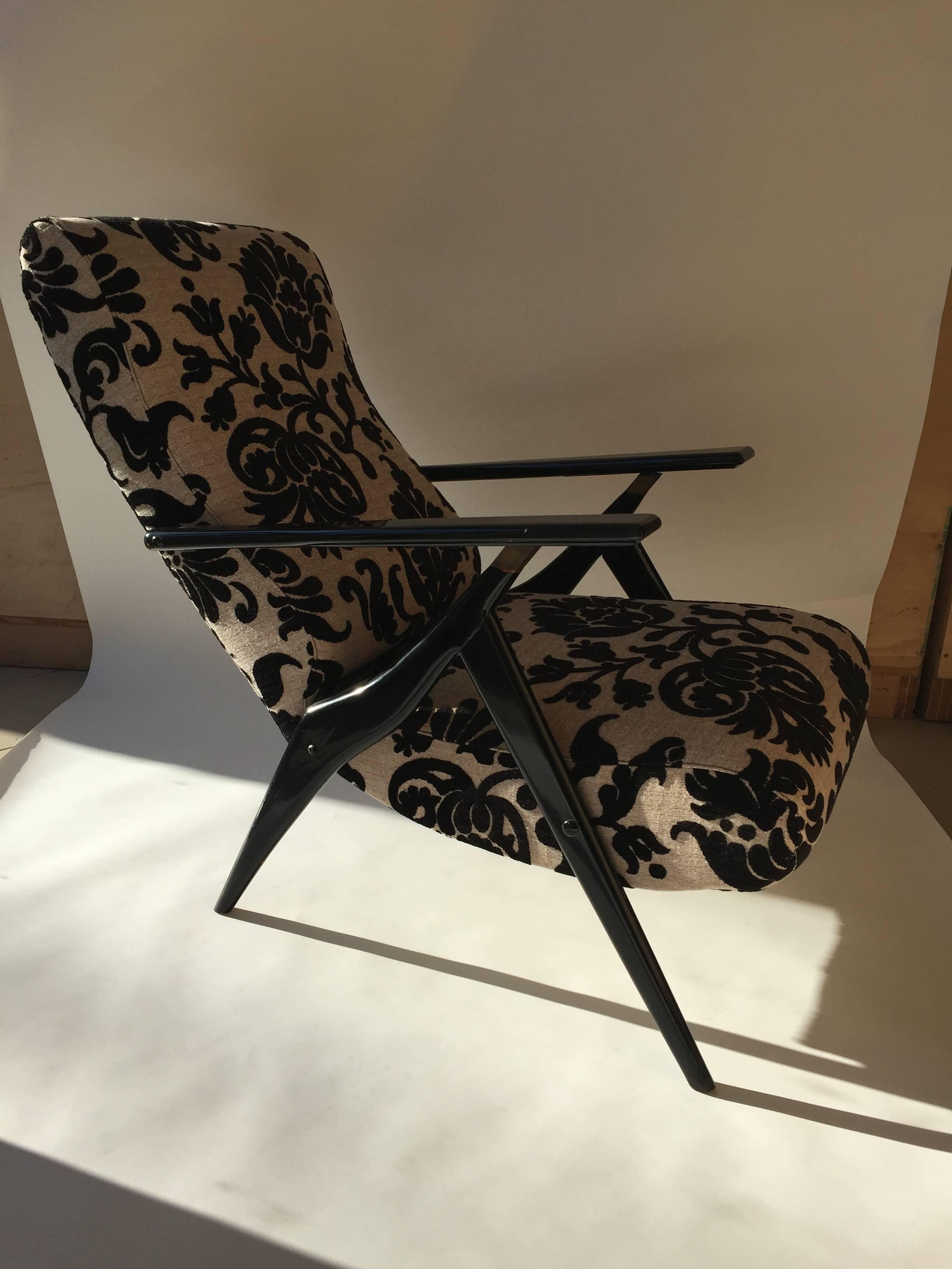 A beautiful Italian lounge chair by Antonio Gorgone, adjustable backrest, upholstered in floral fabric.

Check other beautiful items in our storefront page.