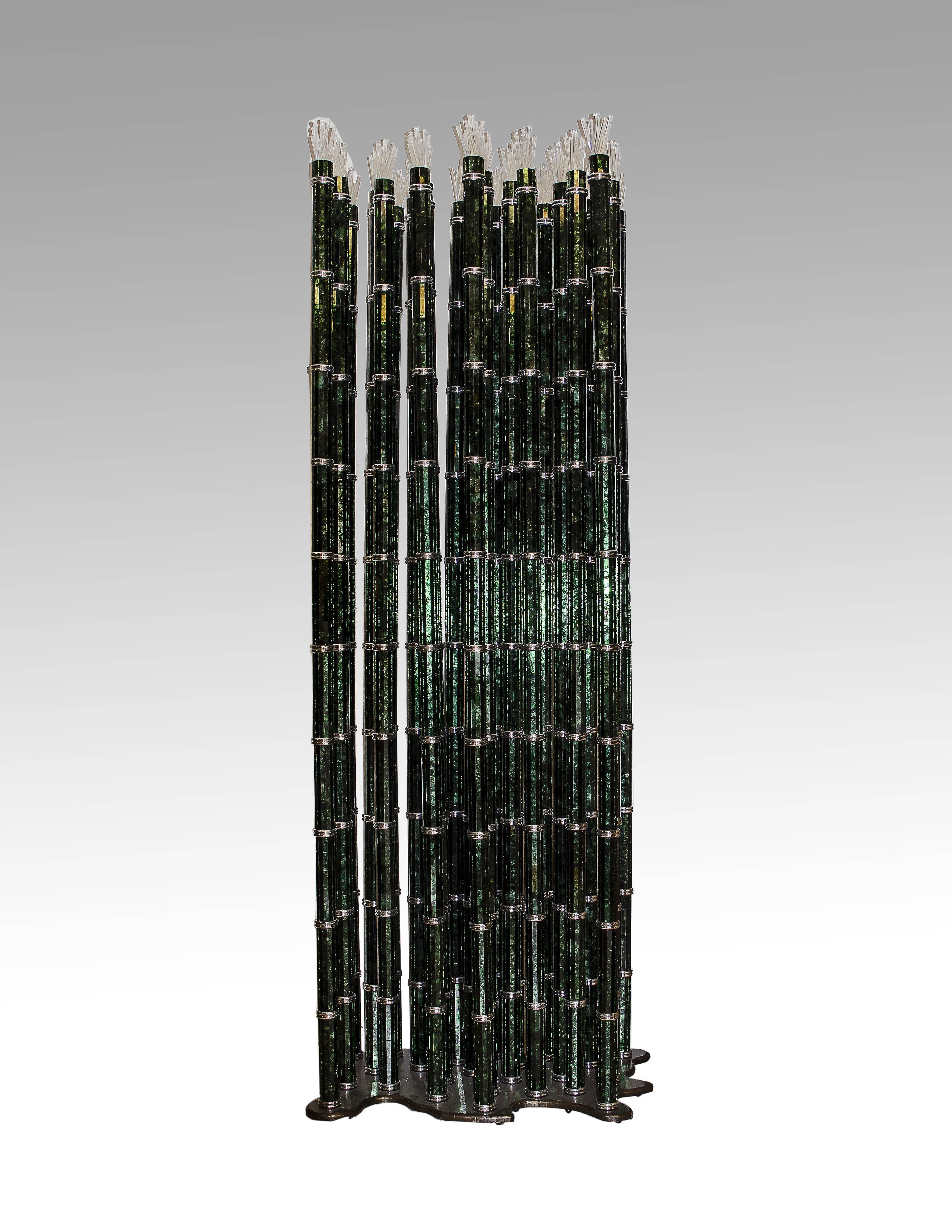 A stunning bamboo sculpture made with 24 stem, each stem is divided in ten Lucite cylinders covered with glass mosaic each one rests on chromium brass ring clear glass part on top. The stems and the base are in heat painted iron also available in