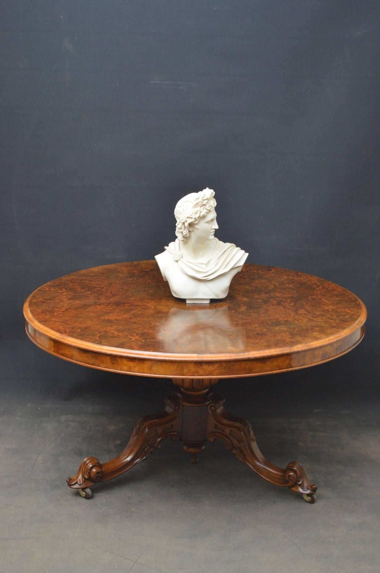 Sn4022 fine quality and very attractive Victorian burr walnut centre table / tilt top table, having stunning burr walnut top with moulded edge, raised on elegant vase shaped column terminating in three scrolled legs and brass castors. This fine