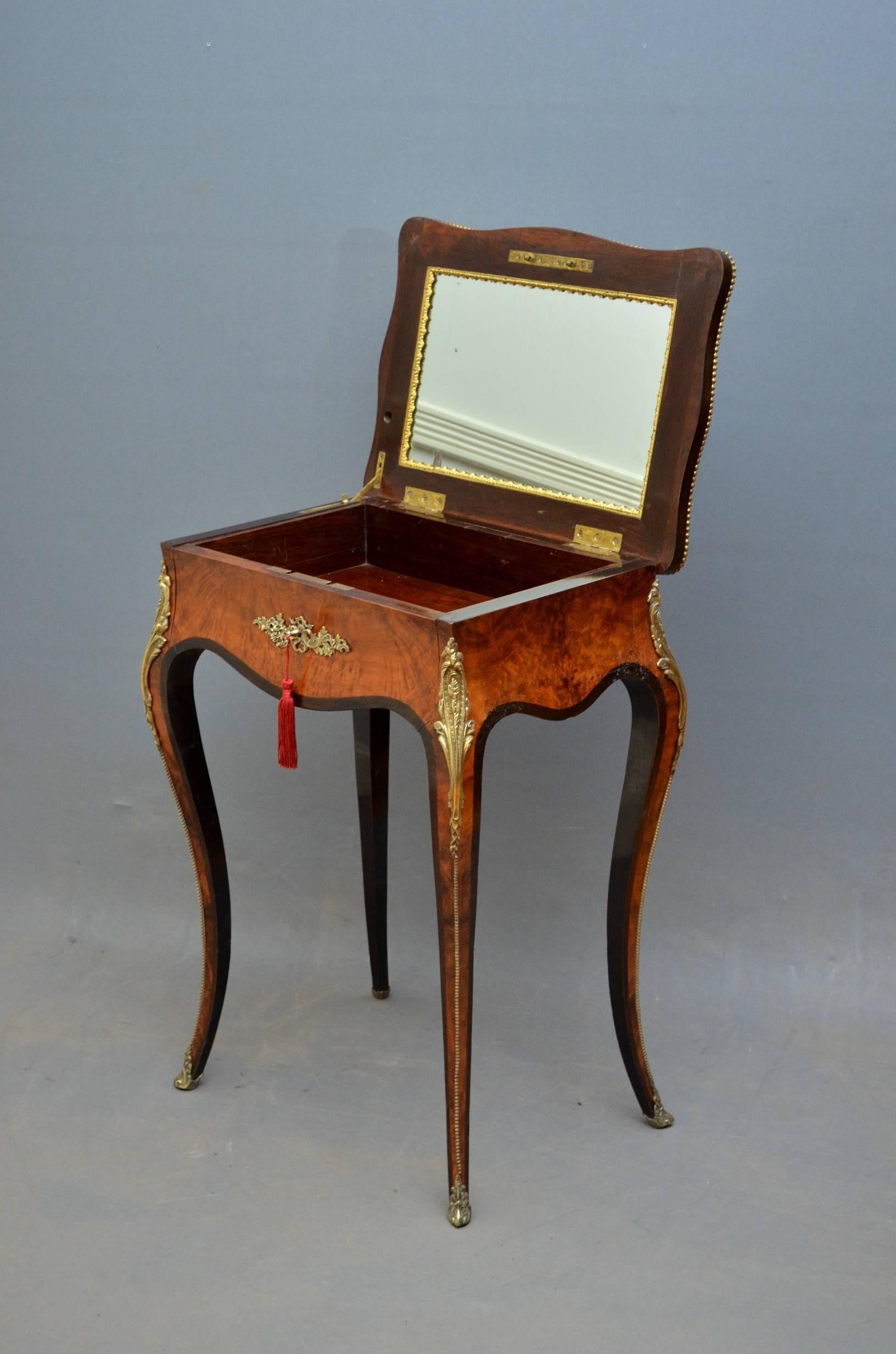Sn3642, exceptional French dressing table or occasional table, having serpentine top with kingwood and ebony banding and brass decorated edge, which opens to reveal original mirror and drawer with original working lock and key, all raised on elegant