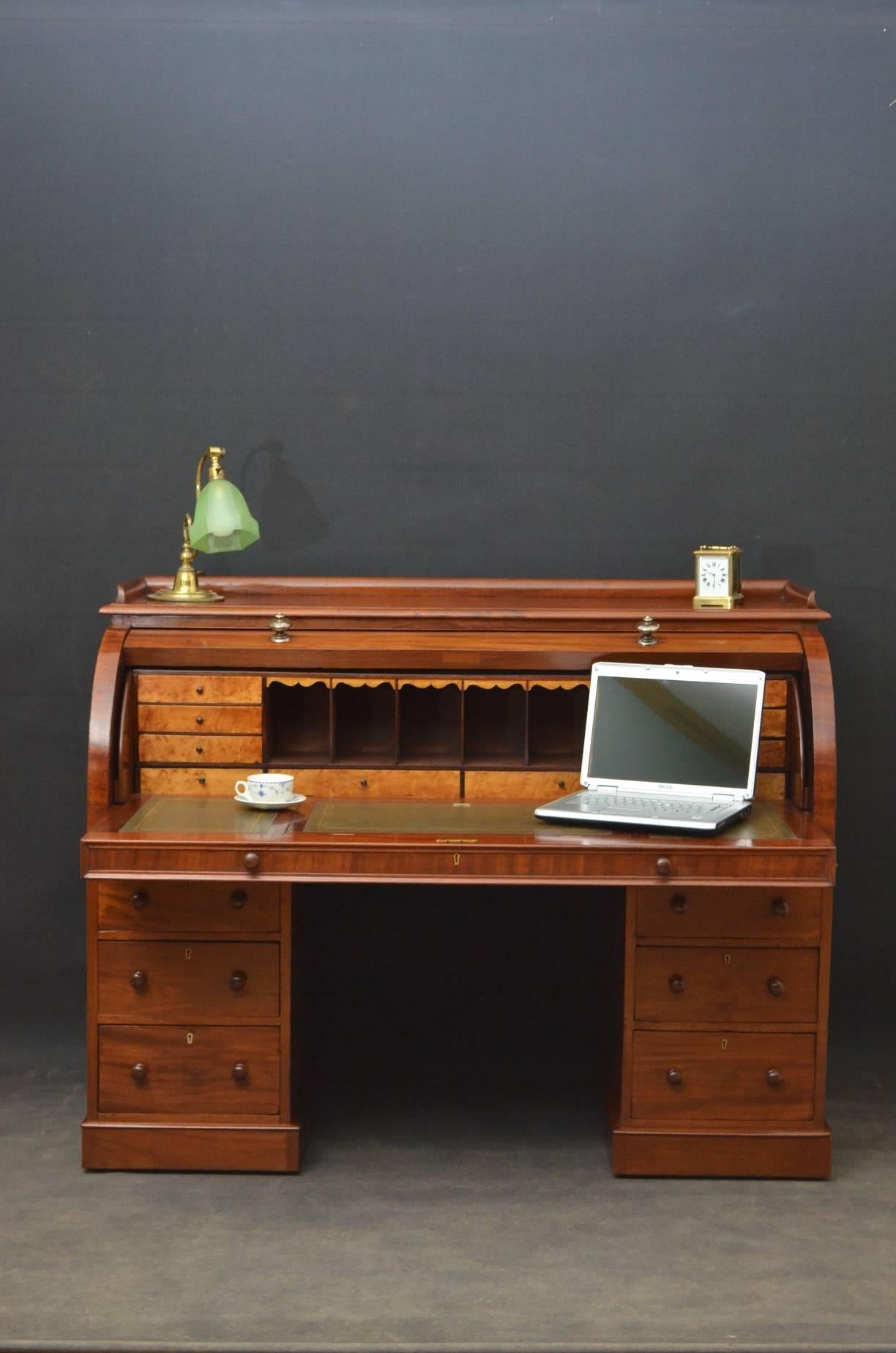 Sn2878 fine example of Victorian, mahogany, twin pedestal cylinder desk, having moulded gallery to top, figured mahogany cylinder fall fitted with exceptional quality brass knobs, enclosing green tooled leather, adjustable writing surface, pigeon