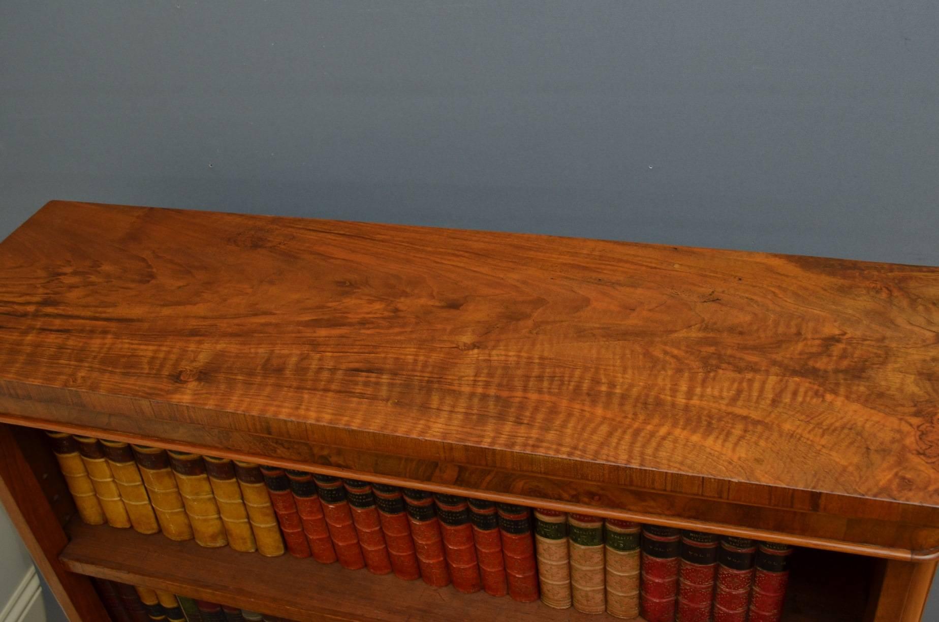 Sn4055, a Victorian figured walnut bookcase, having figured top above 2 height adjustable shelves flanked by rounded corners and figured sides, all standing on plinth base. This Victorian bookcase has been sympathetically restored and is ready to