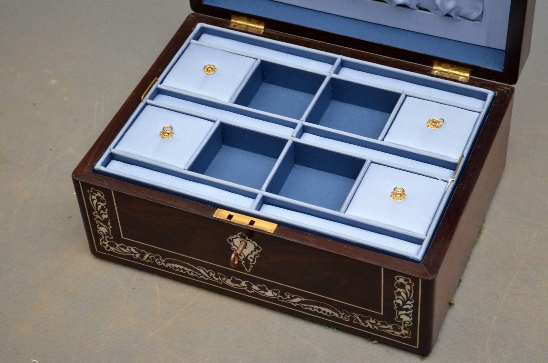 K0191, A superb Regency rosewood and mother-of-pearl jewellery box or sewing box, having profusely inlaid front and hinged top enclosing fabulous relined interior, all fitted with original working lock and key. This beautiful box is in fantastic