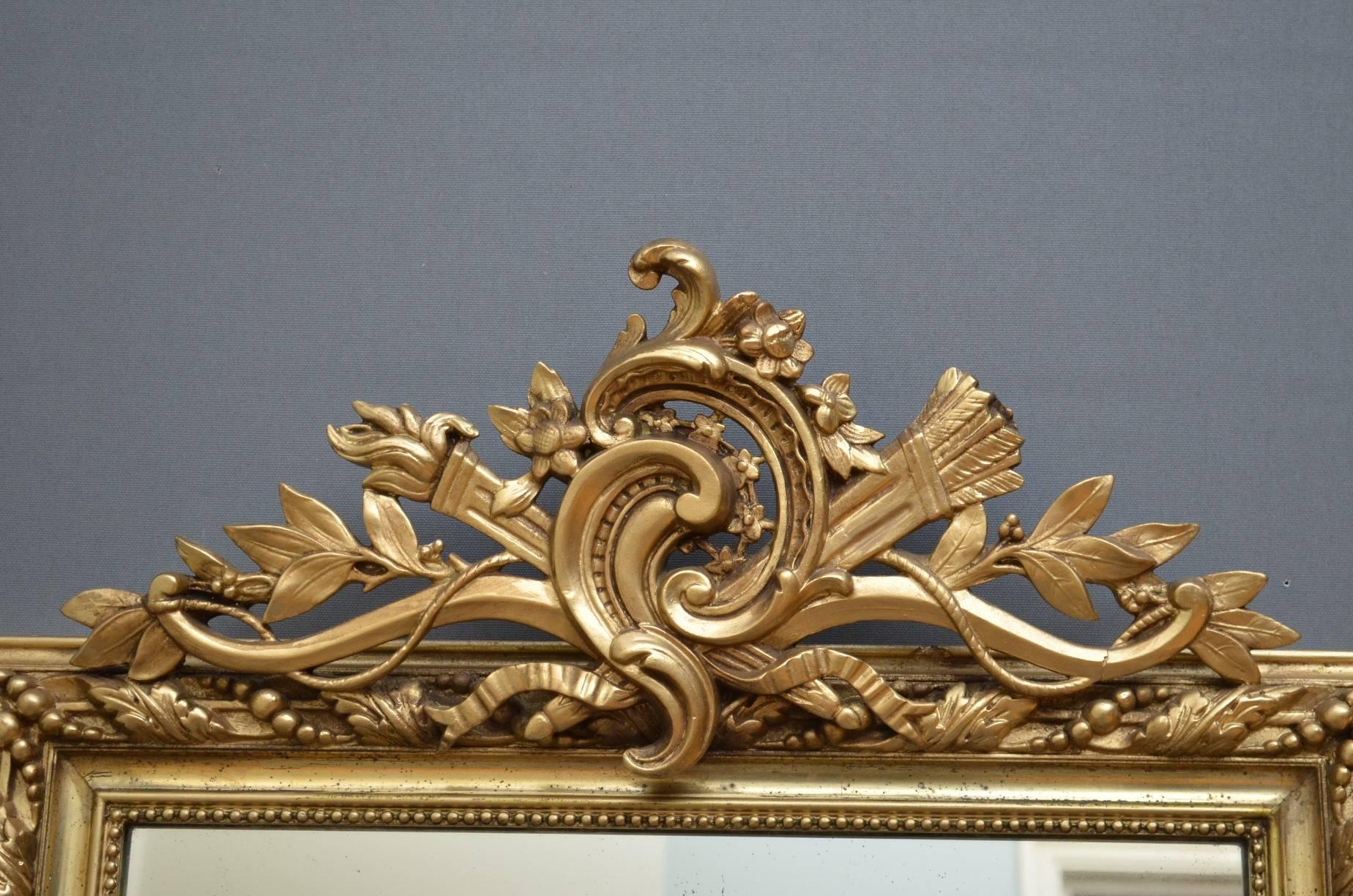 K0220 Elegant 19th century, gilt wall mirror, having fine cresting with scrolls, flowers and leaves to top and original mirror plate in carved frame. This attractive overmantel has been refinished and is fantastic condition throughout ready to place