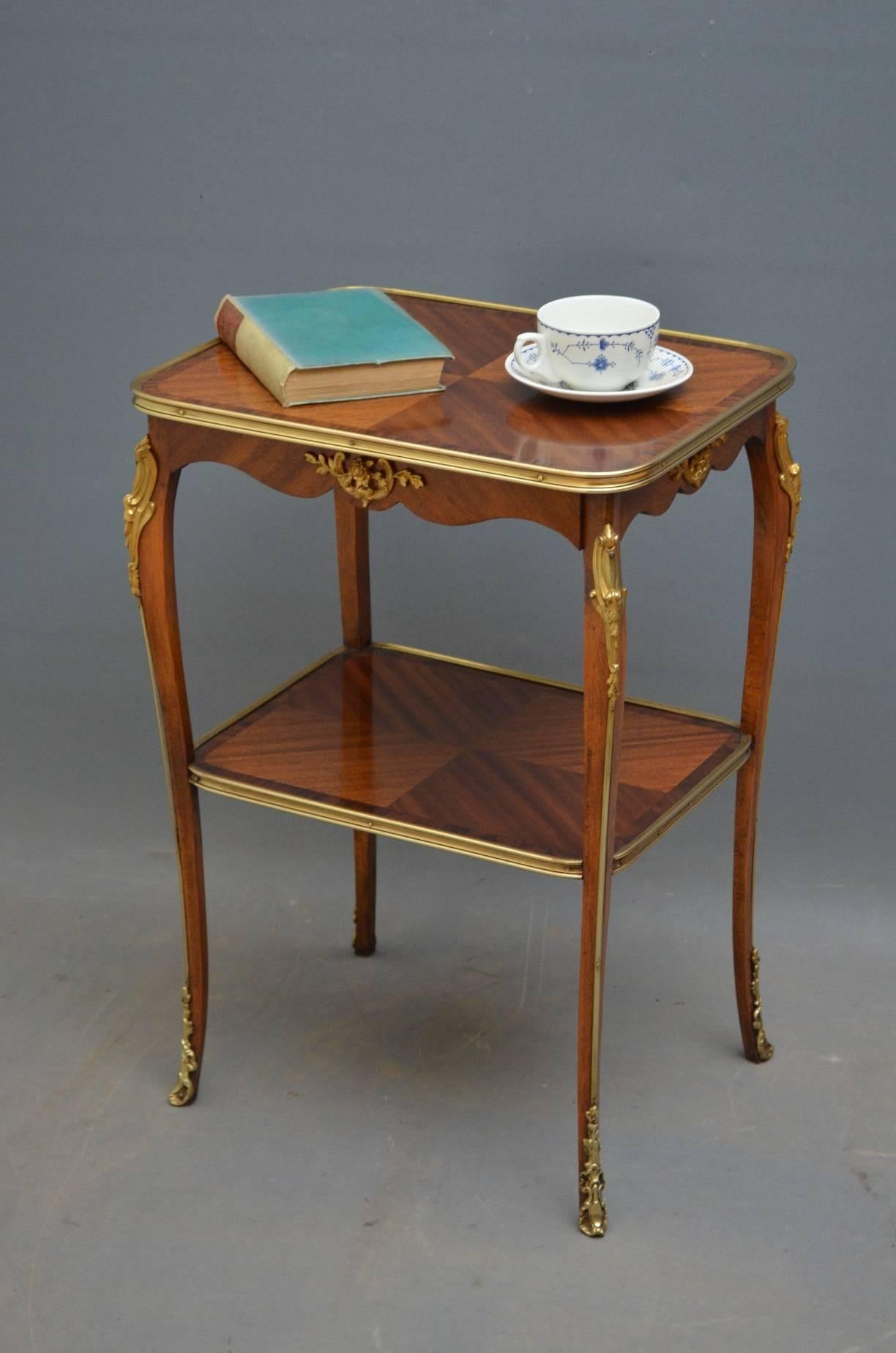 K0179 an elegant French occasional table having bookmatched quarter veneered top with rosewood crossbanding and brass edge above a small frieze drawer, all standing on slender legs united by undertier, all with fine brass decoration throughout. This