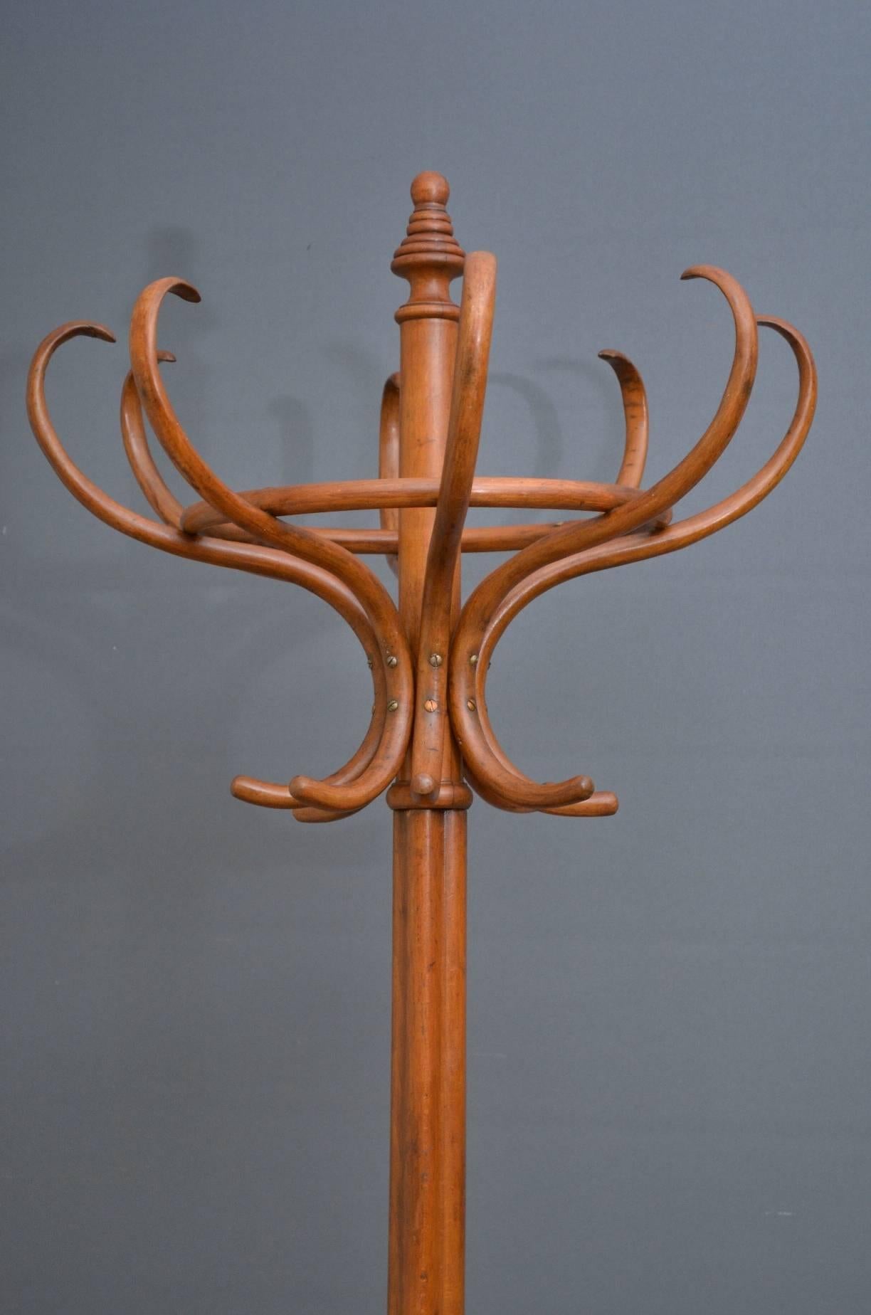 K0240 fine example of Czechoslovakian bentwood hat stand or hall Stand, having eight coat hooks and eight bentwood scrolls for hats, surmounted by a turned beehive finial, supported on cluster column terminating in four downswept legs with a ring