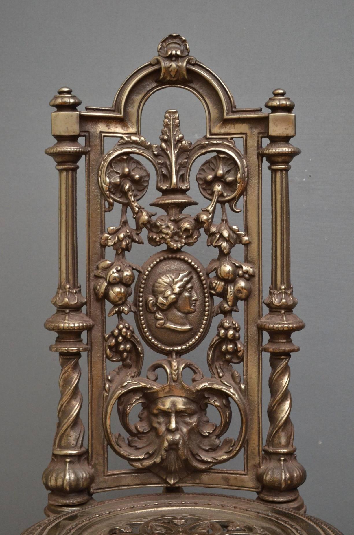 Sn4133, very decorative pair of cast iron chairs, having tall backs with pierced foliage design flanked by twisted columns and intricate medallion seats, standing on cabriole legs.
Measures: H39