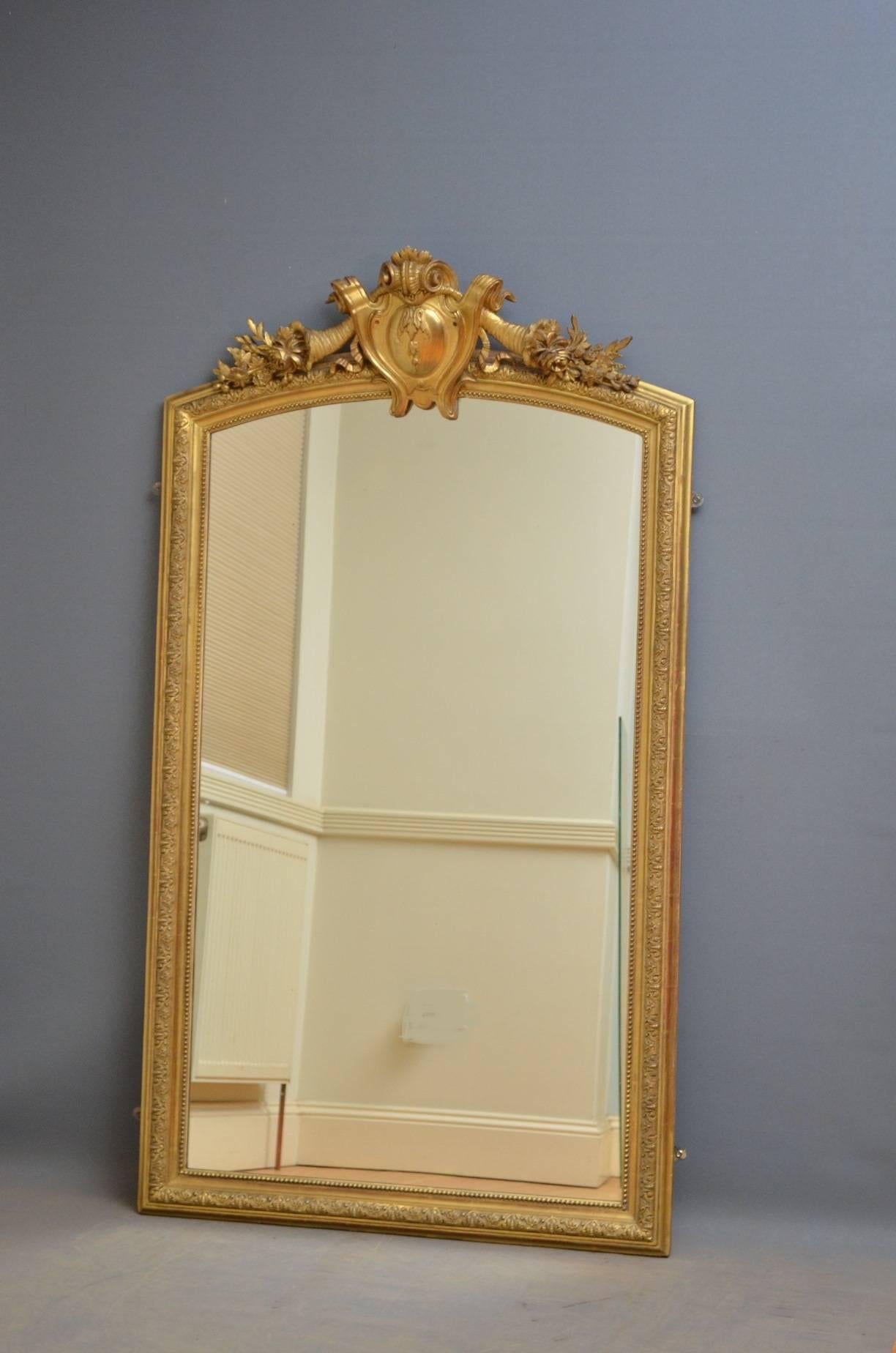 Sn4144 French 19th century giltwood mirror, having large carouche to centre flanked by floral motifs and finely carved frame. This excellent wall mirror retains original gilt throughout, all in wonderful condition, ready to place at home, circa