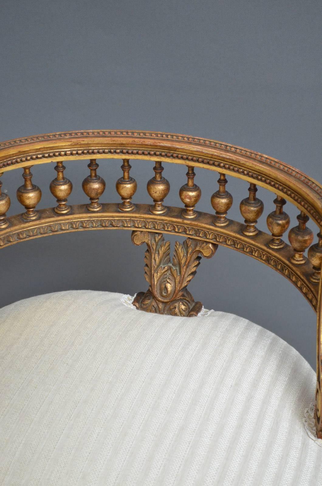 Sn4029 Turn of the century giltwood bedroom chair with low back rails, bulbous spindles and leaf carved arms, newly recovered seat and turned reeded legs. This chairs is in fantastic original condition, circa 1900
Measures: H 17, H 24.5?, W 20?, D