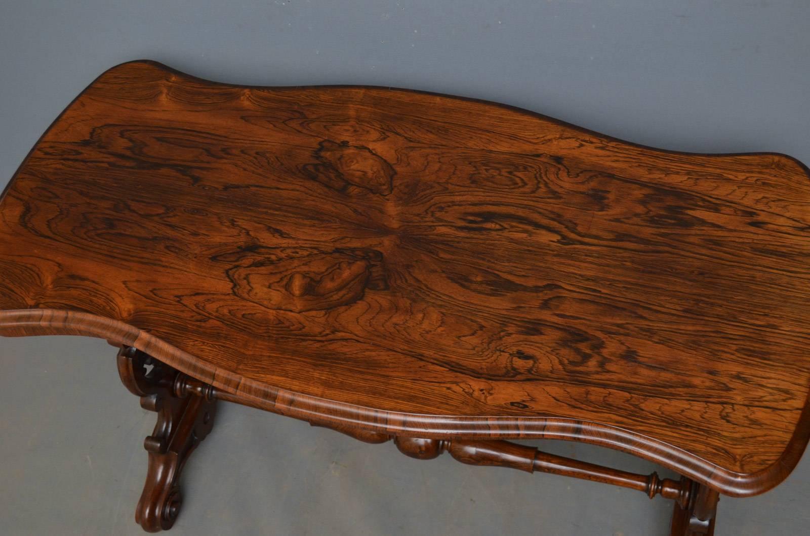 A Victorian rosewood occasional table with stunning serpentine top and finely carved uprights terminating in carved cabriole legs and brass castors united by turned stretcher, circa 1870
Measure: H 29.5? x W 42.5? x D 21?
H 75cm x W 108cm x D 53cm.