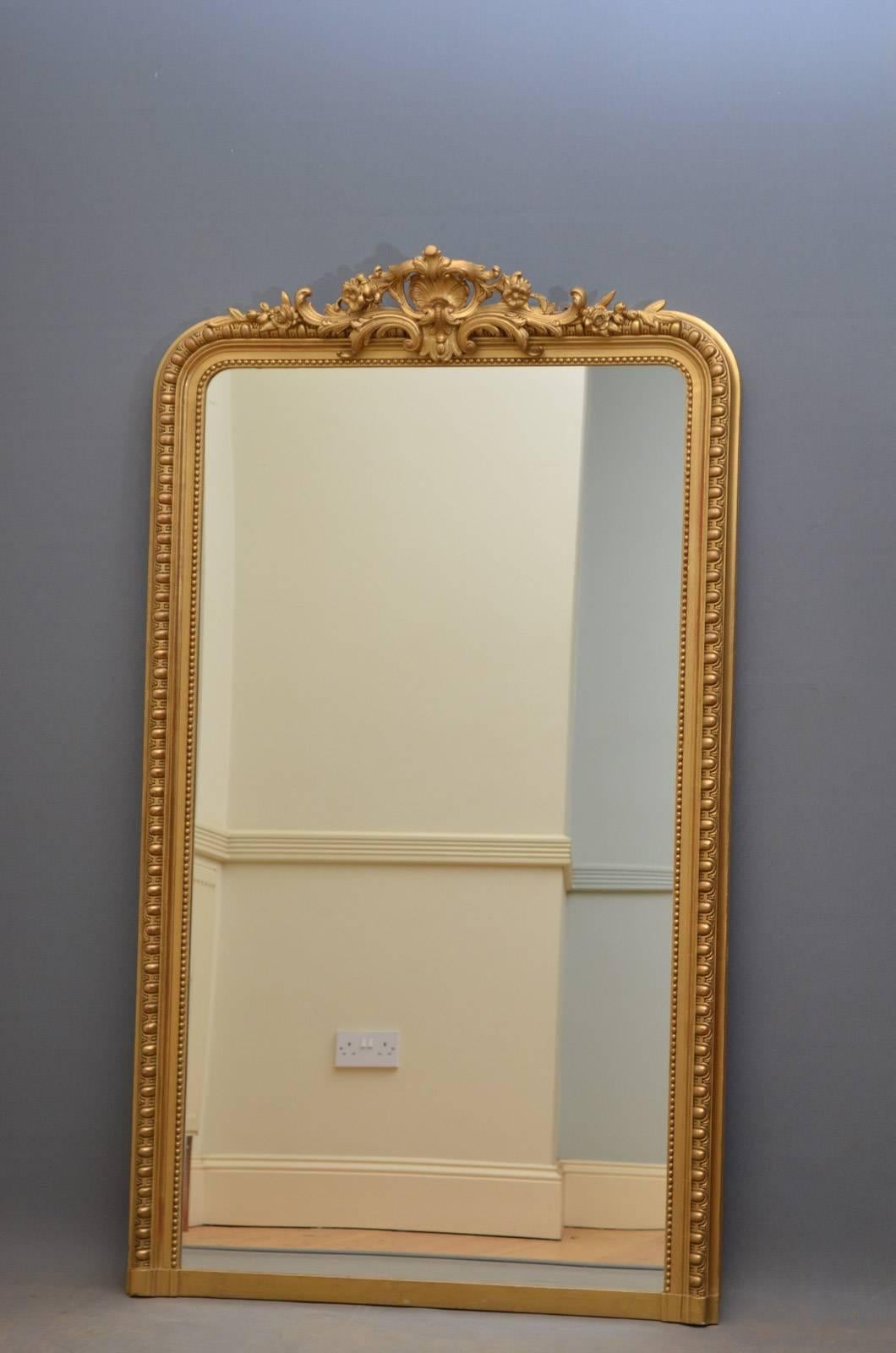 K0246 A 19th century giltwood mirror, having fine shell decoration to centre flanked by floral motifs and finely carved frame. This antique has been refinished and is fantastic condition throughout – ready to place at home. circa 1880
Measures: H