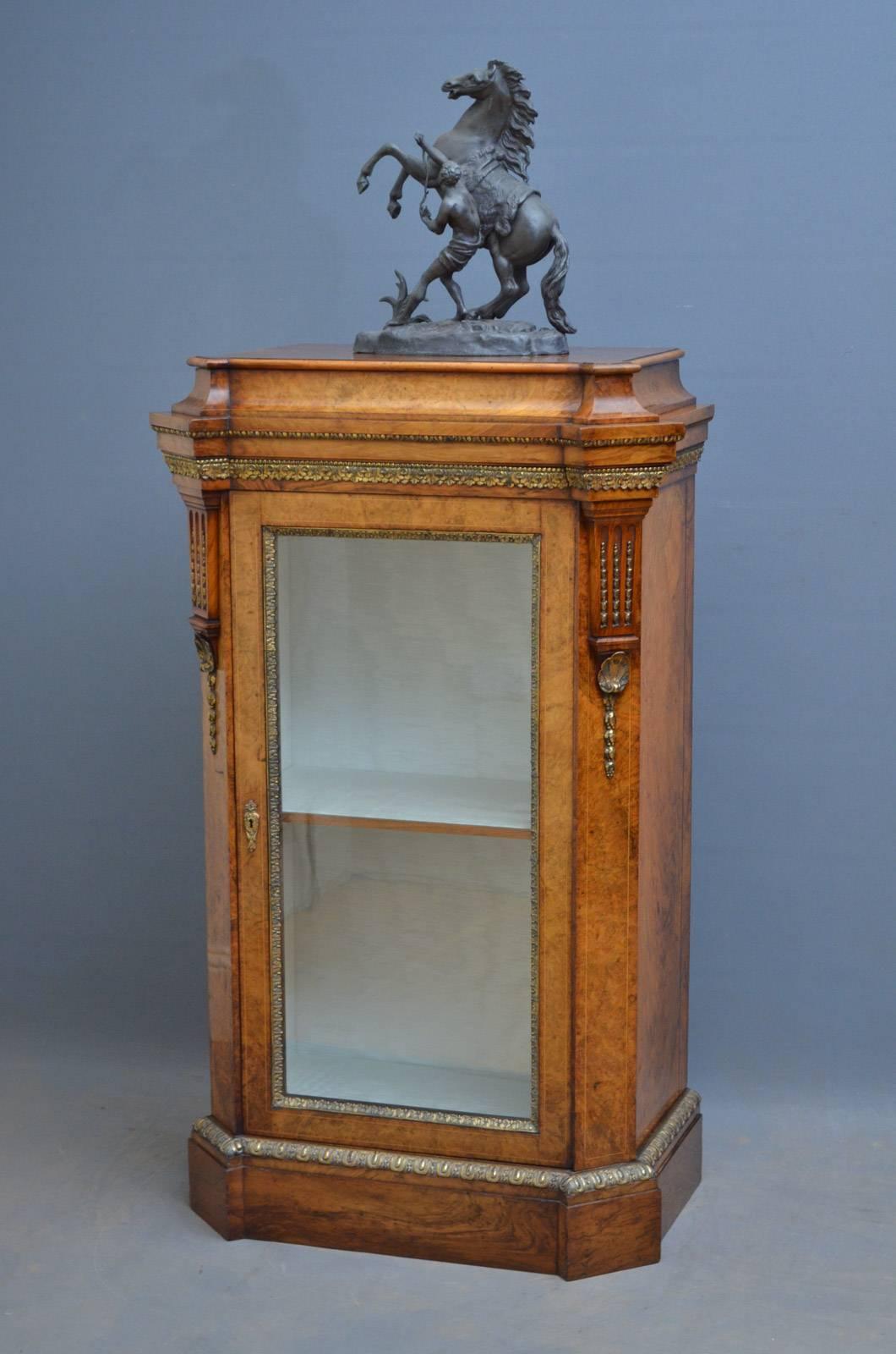 Sn4204 A superb quality, Victorian figured walnut, display cabinet of unusual proportions being tall and slim, having figured walnut, moulded top with concave frieze and glazed door enclosing relined interior, flanked by canted corners with fluted