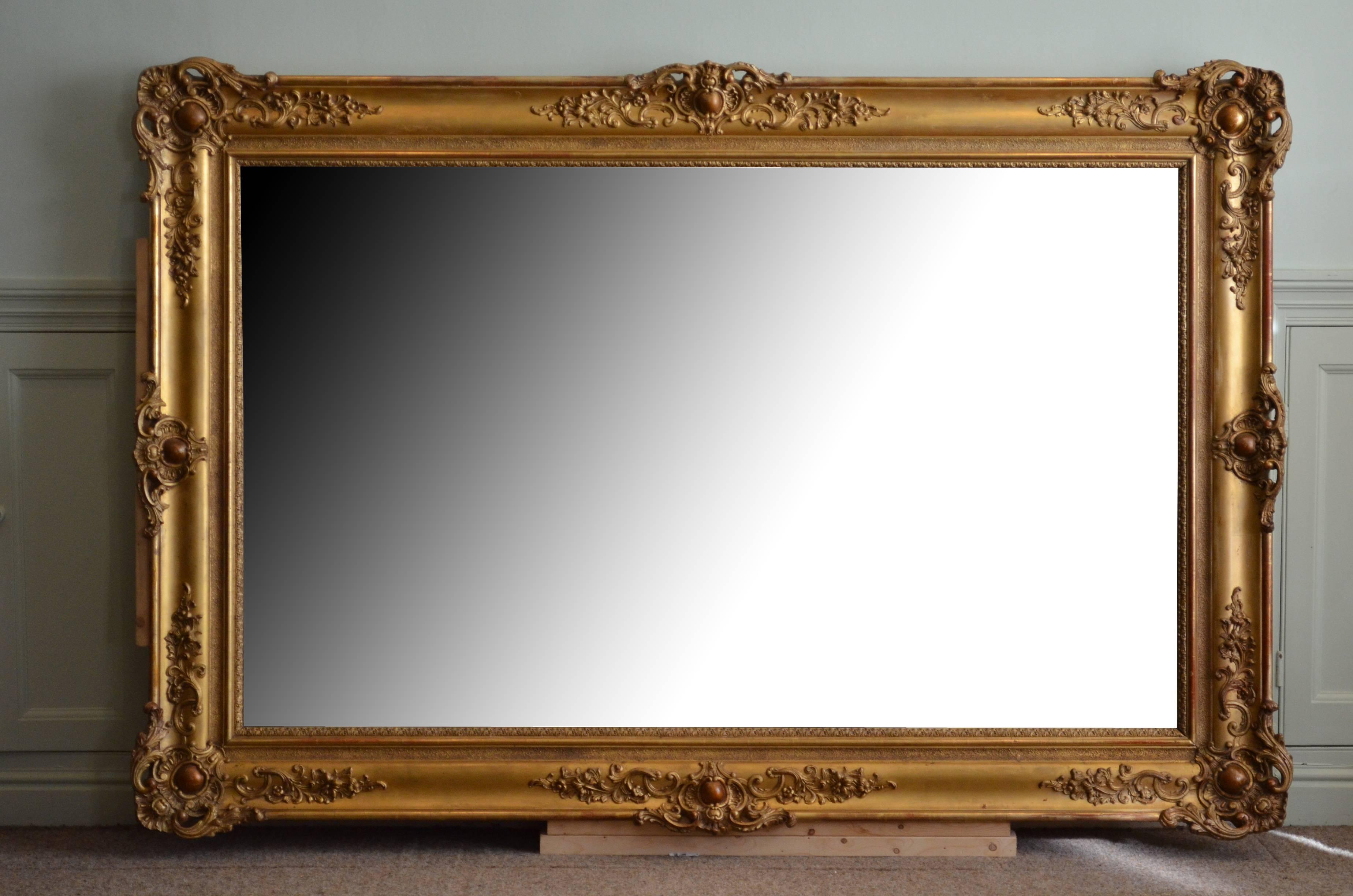 Sn4225 A XIXth century French mirror of versatile form could be positioned portrait and landscape ways, having original mirror plate with some foxing and imperfections in beautifully carved gilded frame. This fantastic mirror has been