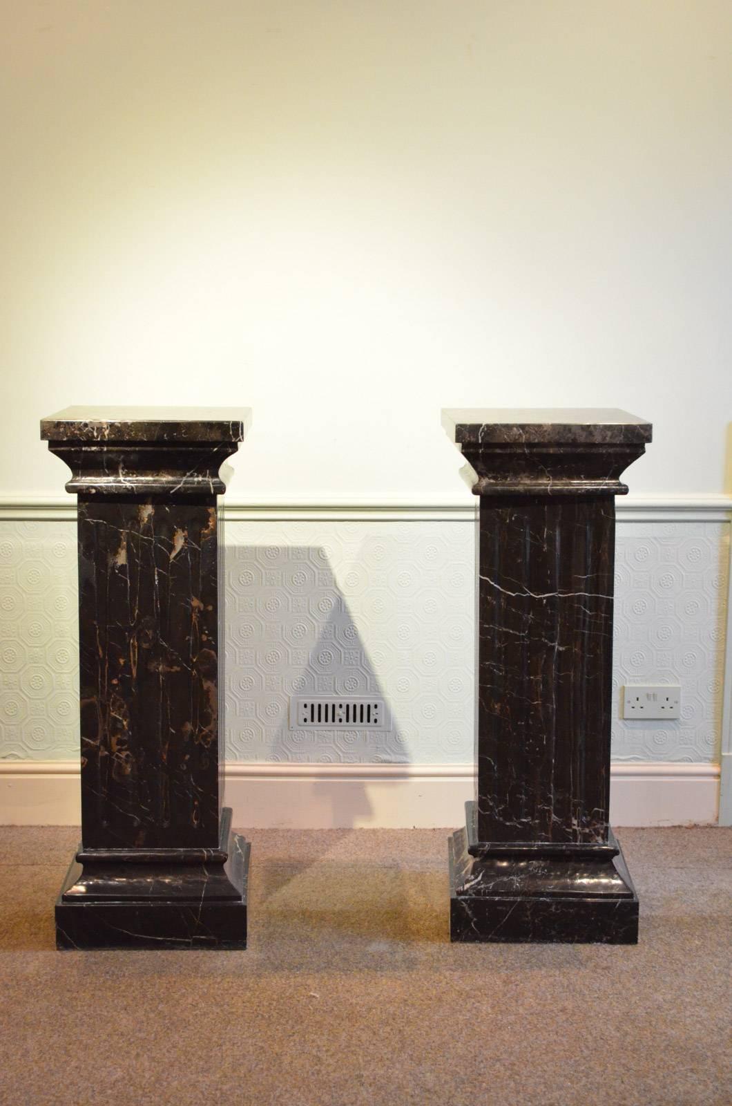 Sn4231  A superb pair of 19th century black veined columns, each having generous top being 40cm x40cm with concave frieze and fluted body terminating in moulded base. This pair of antique columns is hand made in solid marble. c1850
H43.5