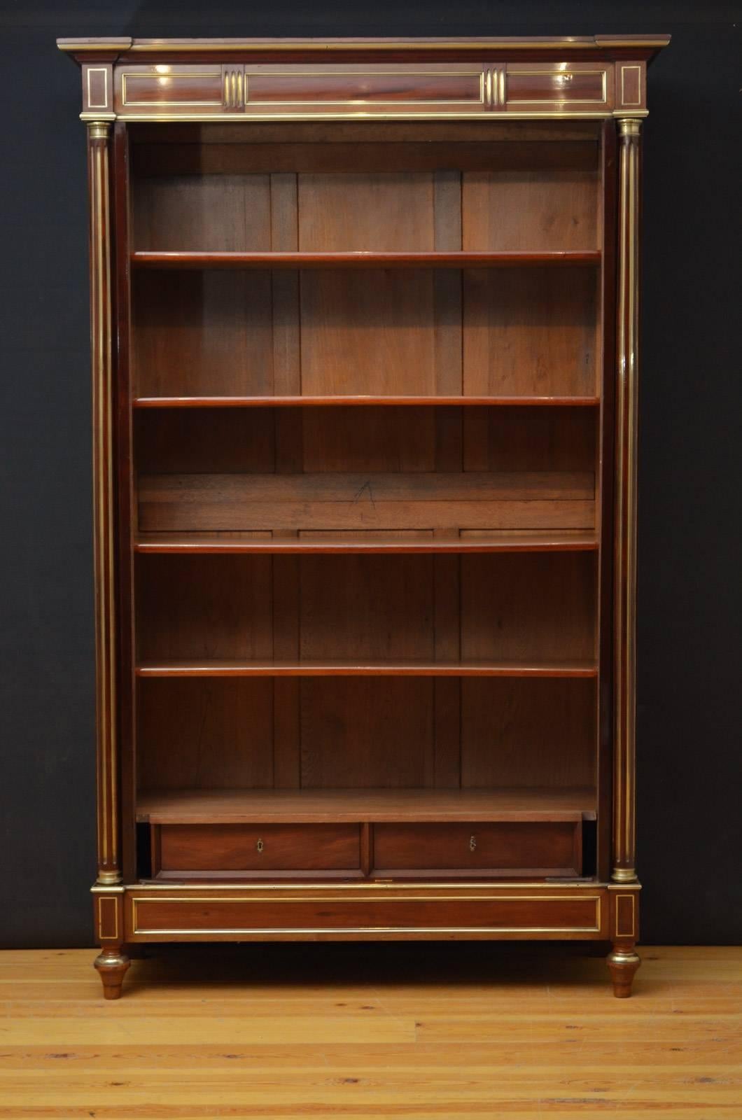Sn4269 fantastic 19th century brass inlaid bookcase in mahogany, having moulded cornice above a pair of bevelled edge glazed doors fitted with original working lock and a key and enclosing 4 height adjustable shelves and two drawers, all flanked by
