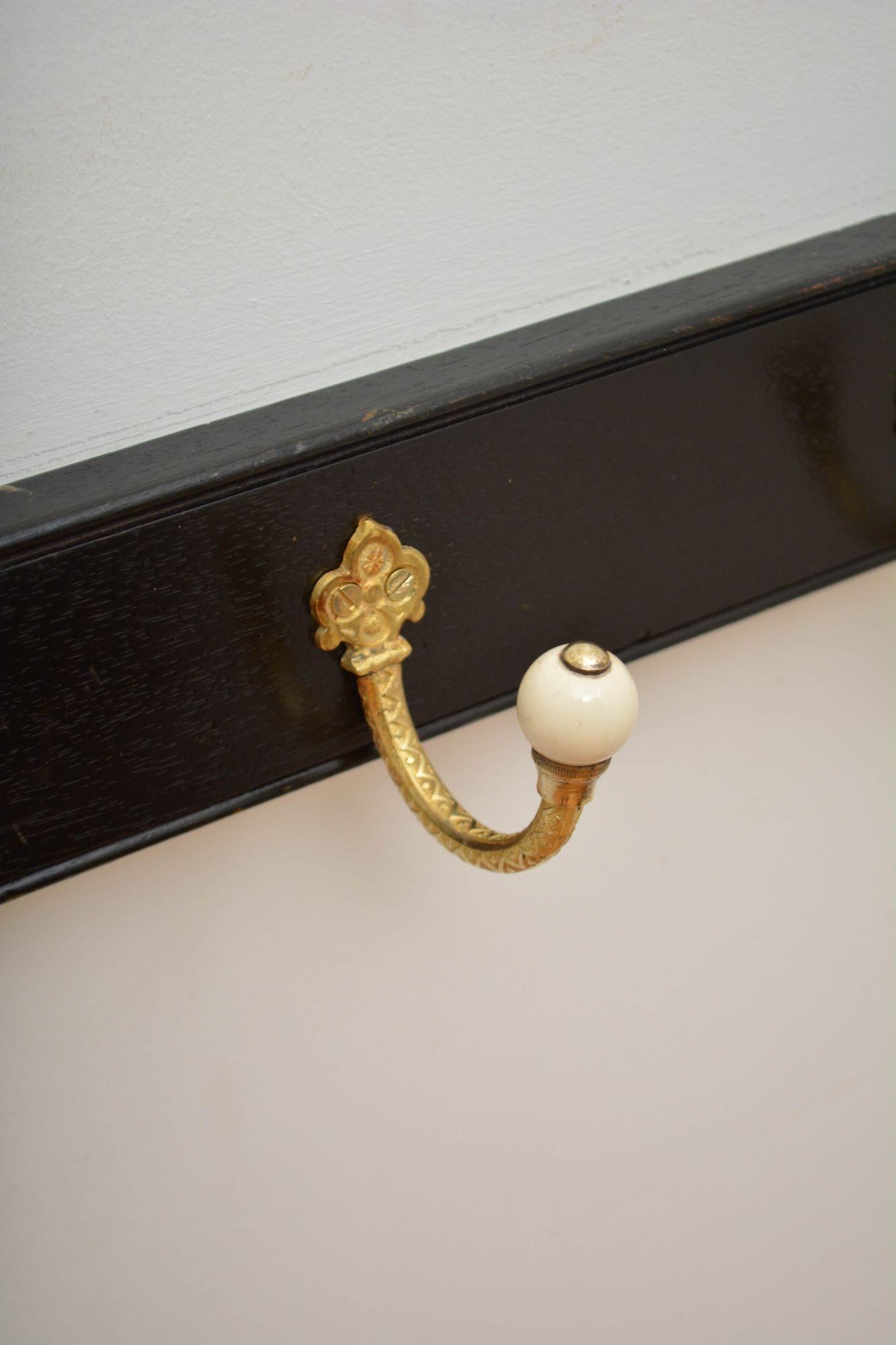 19th Century Pair Of Ebonised Brass And Ceramic Coat Rack Coat Hooks For Sale