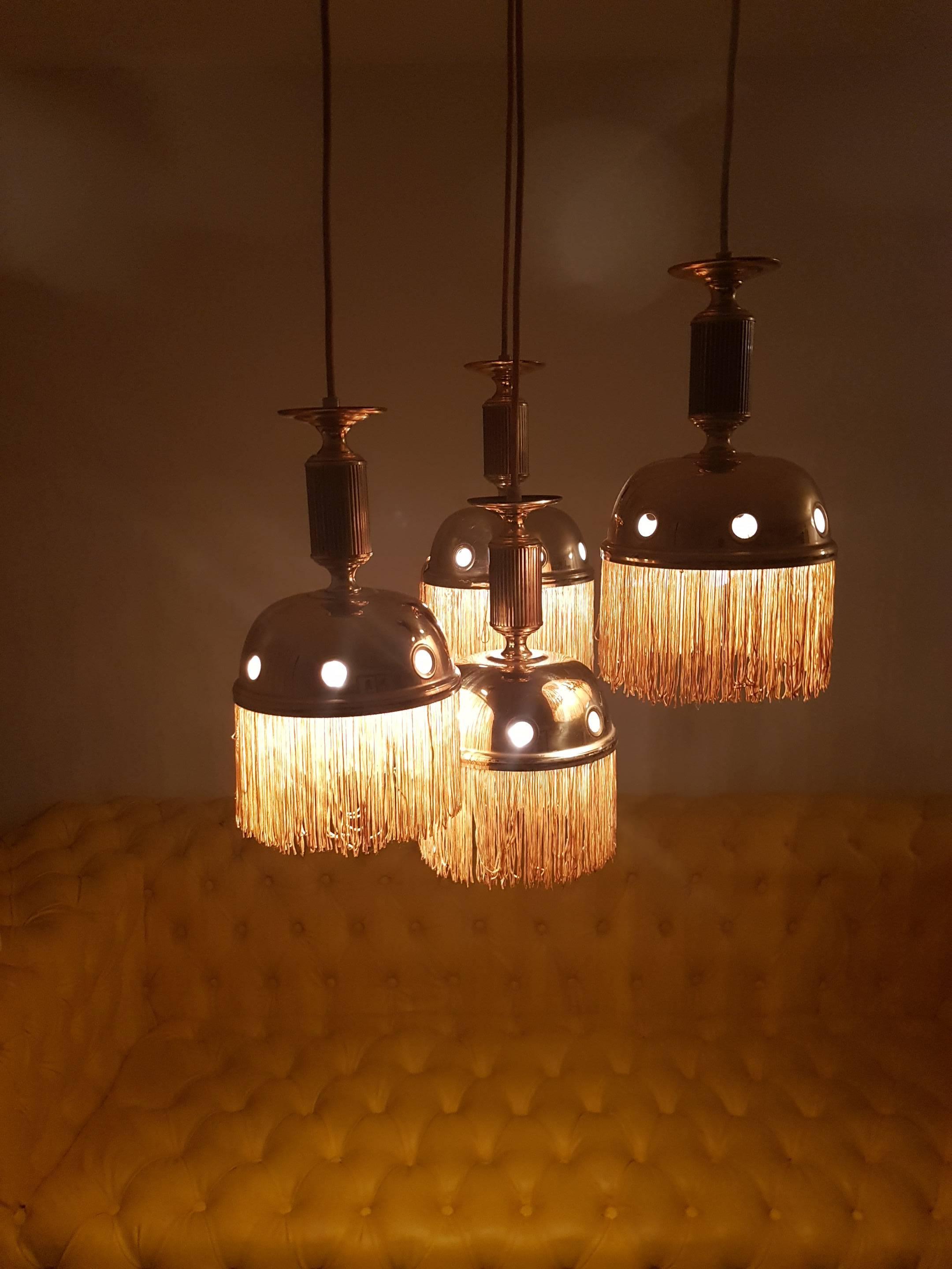 Set of one large chandelier and one Cascade chandelier so in total five lamps, very stylish 1960-1970s designer unknown but a eye catcher.
Measures: 38cm diameter for big lamp
and 50 cm for small group lamp
length of wire can be adjusted.

the 