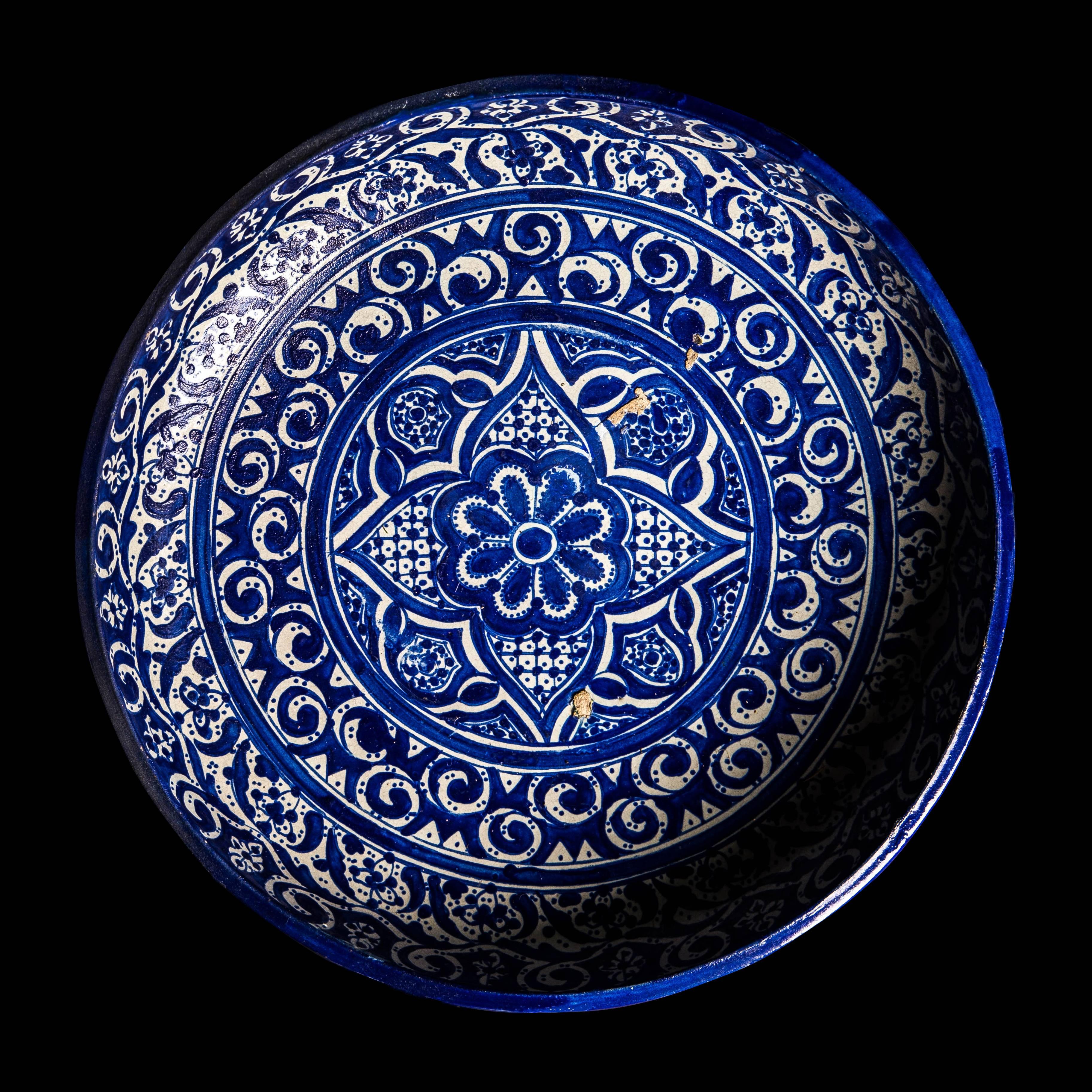 A beautiful late 19th century decorative Moroccan bowl with characteristic intricate Fez design and deep cobalt glaze. 

  