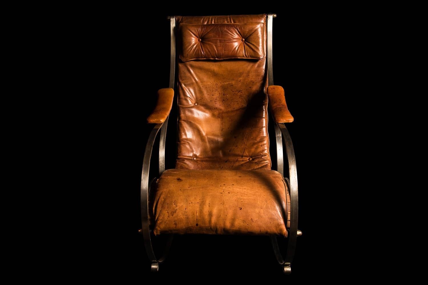 Designed by R Winfield, a landmark modernist piece hugely ahead of its time, as exhibited at the 1851 exhibition. This is a statement chair, with exquisite lines and hugely comfortable. The soft tan leather is original, it is scuffed, but not torn
