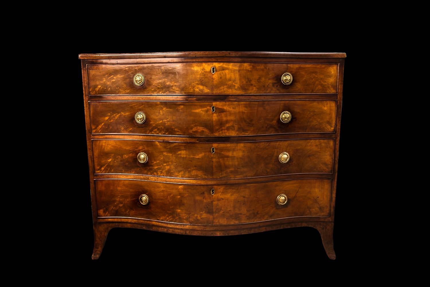 The serpentine rectangular moulded top above four graduated drawers, on gently splayed feet with S-pattern keyholes, the handles old but not original, all four drawers fully lined in cedar.

The use of S-pattern keyholes is seen on work by leading