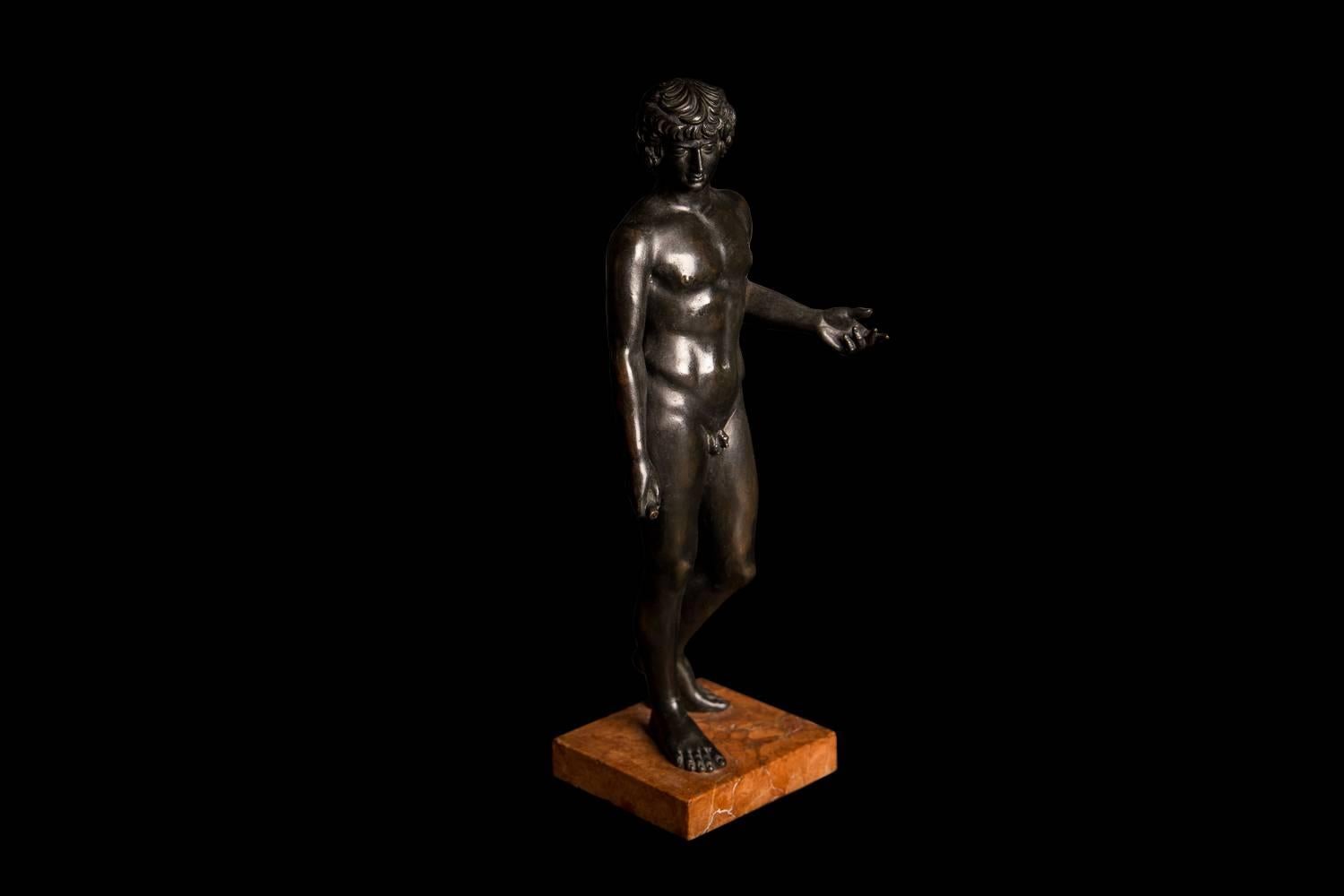 Mounted on red marble base. After the antique - now on display in the Naples National Archaeological Museum. Antinous was the lover of Hadrian and was regarded as the most beautiful man of his age.