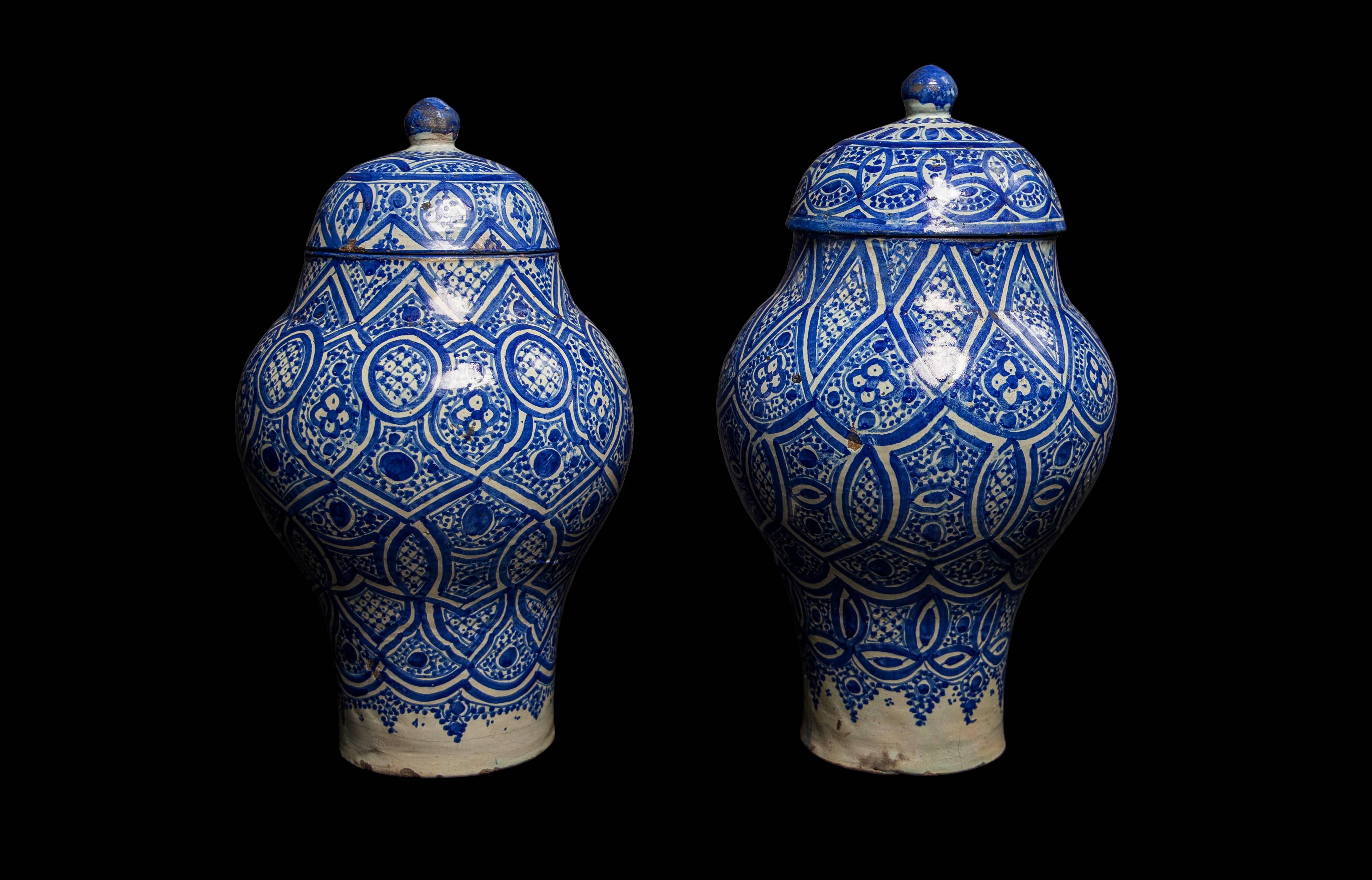 Originally used to preserve meat, these jars exude a personal quality and aged character. The blue and white geometric patterned glaze and shape is intrinsic to Fez pottery of this era. These pieces work beautifully in contemporary settings, lending