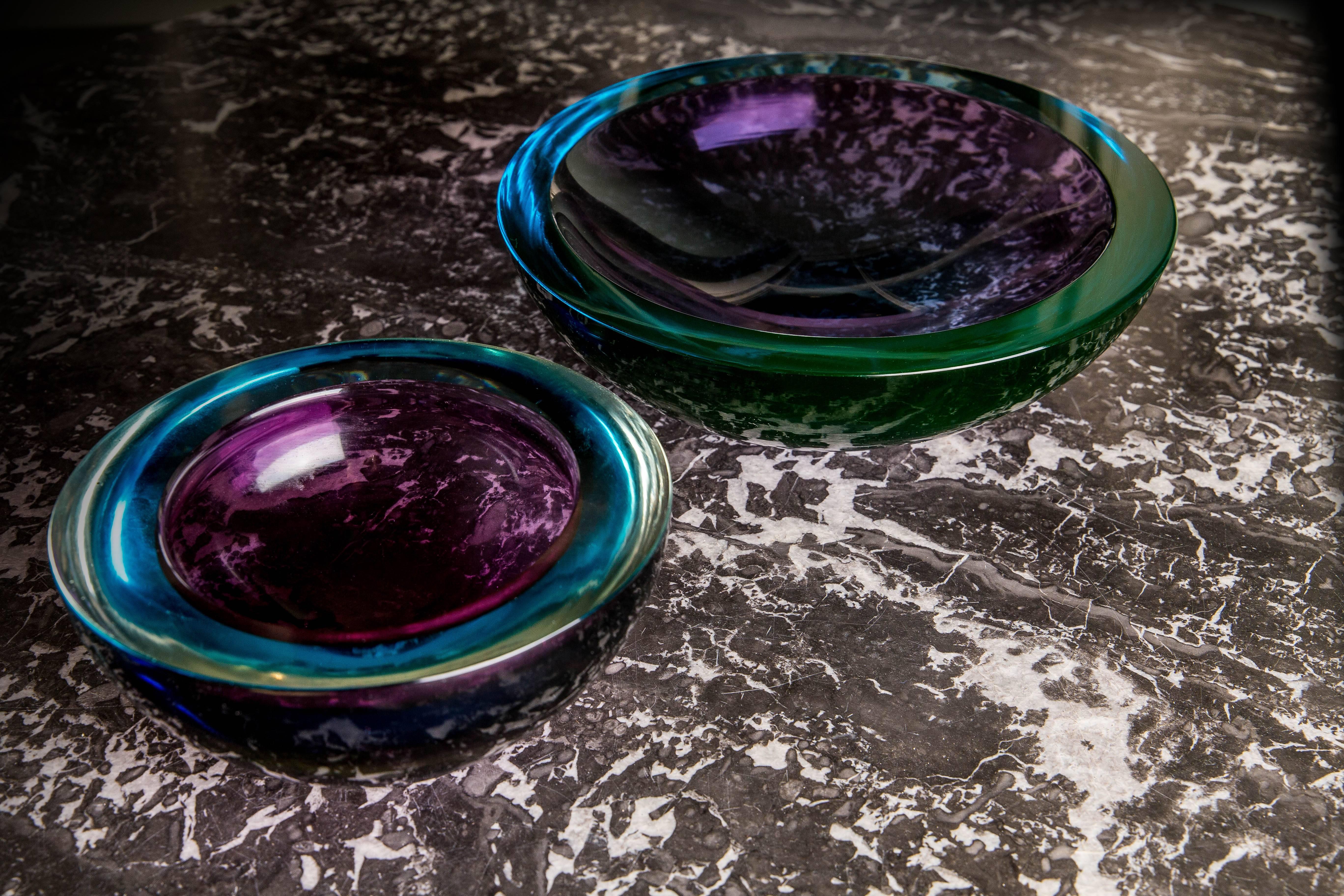 Exceptional Murano handblown Sommerso violet and green turquoise glass bowls with flat cut rims by designer/artist Flavio Poli. Stunning as a pair, exceptionally heavy thick Murano glass. The beautifully matched colours are a signature of his iconic