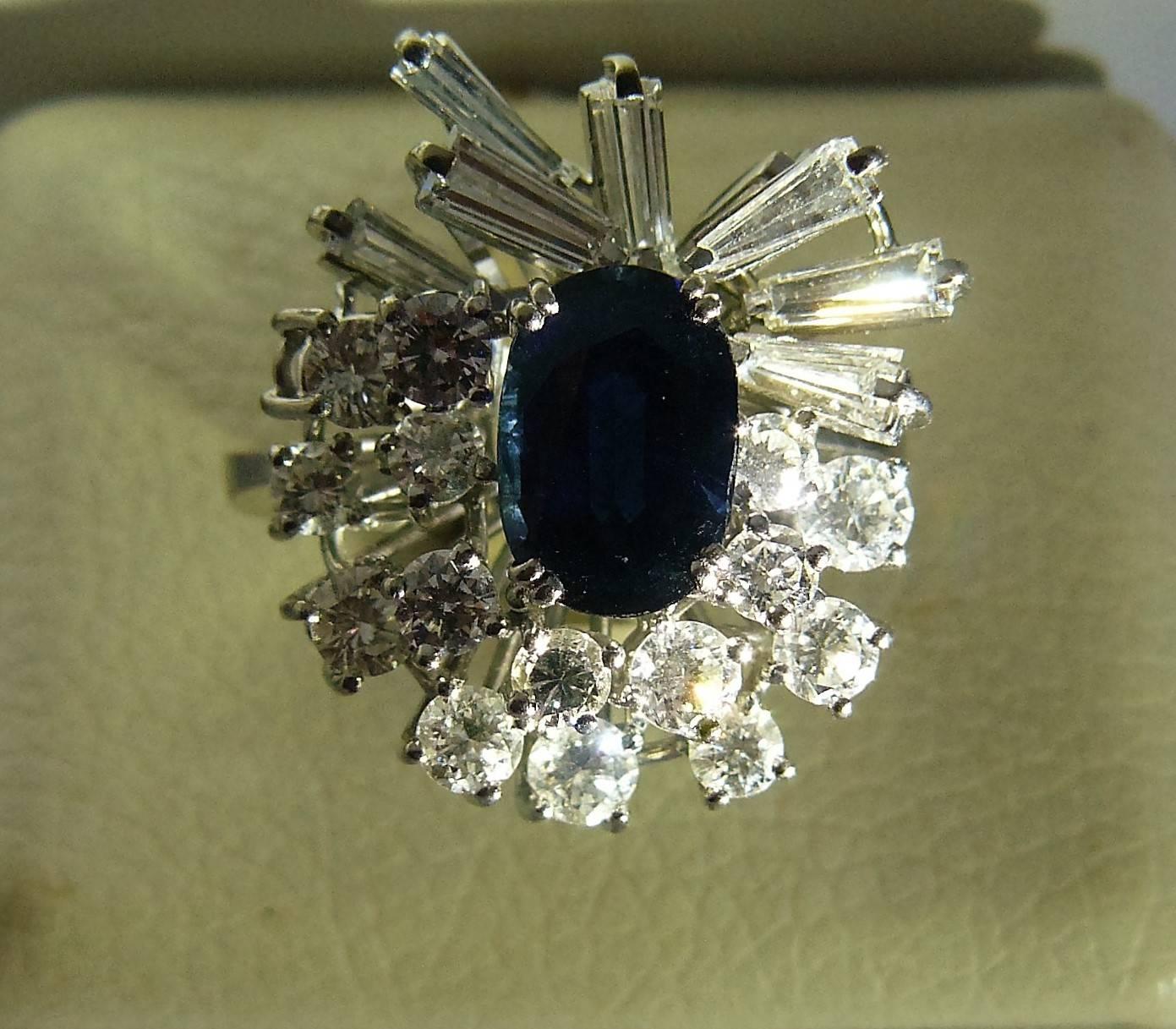 This impressive vintage sapphire and diamond ring has been crafted in 18-karat white gold (circa 1970s).
Weight of sapphire:approximately: 2.20cts;(oval:10X7 mm).
Weight of diamonds; approximately: 3cts.(brilliant modern cut ,tapers).
Diamonds