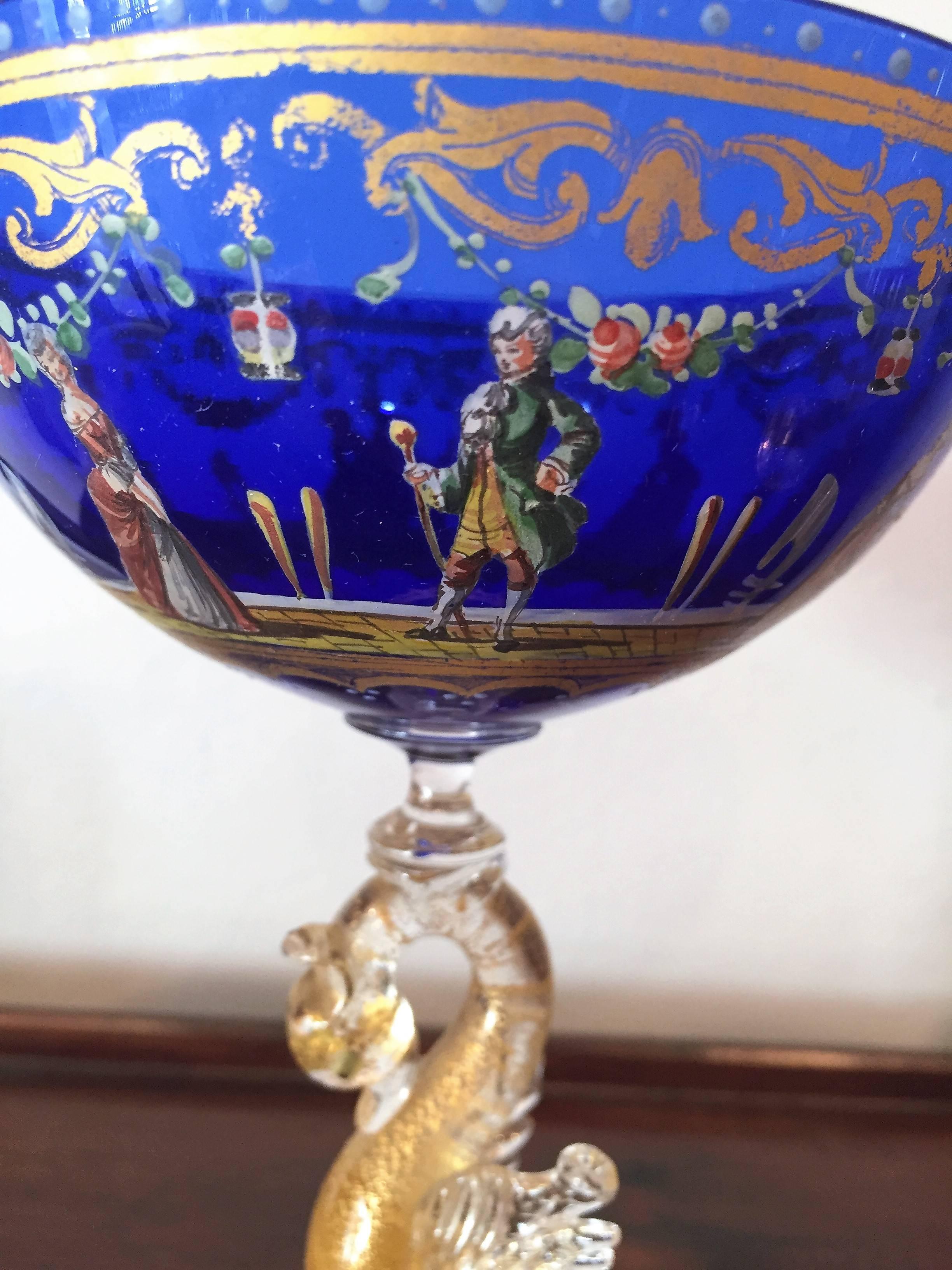 Fabulous hand enameled figural gold gilded cobalt blue glass with a dolphin.
Very rare glass in a very good condition.
 